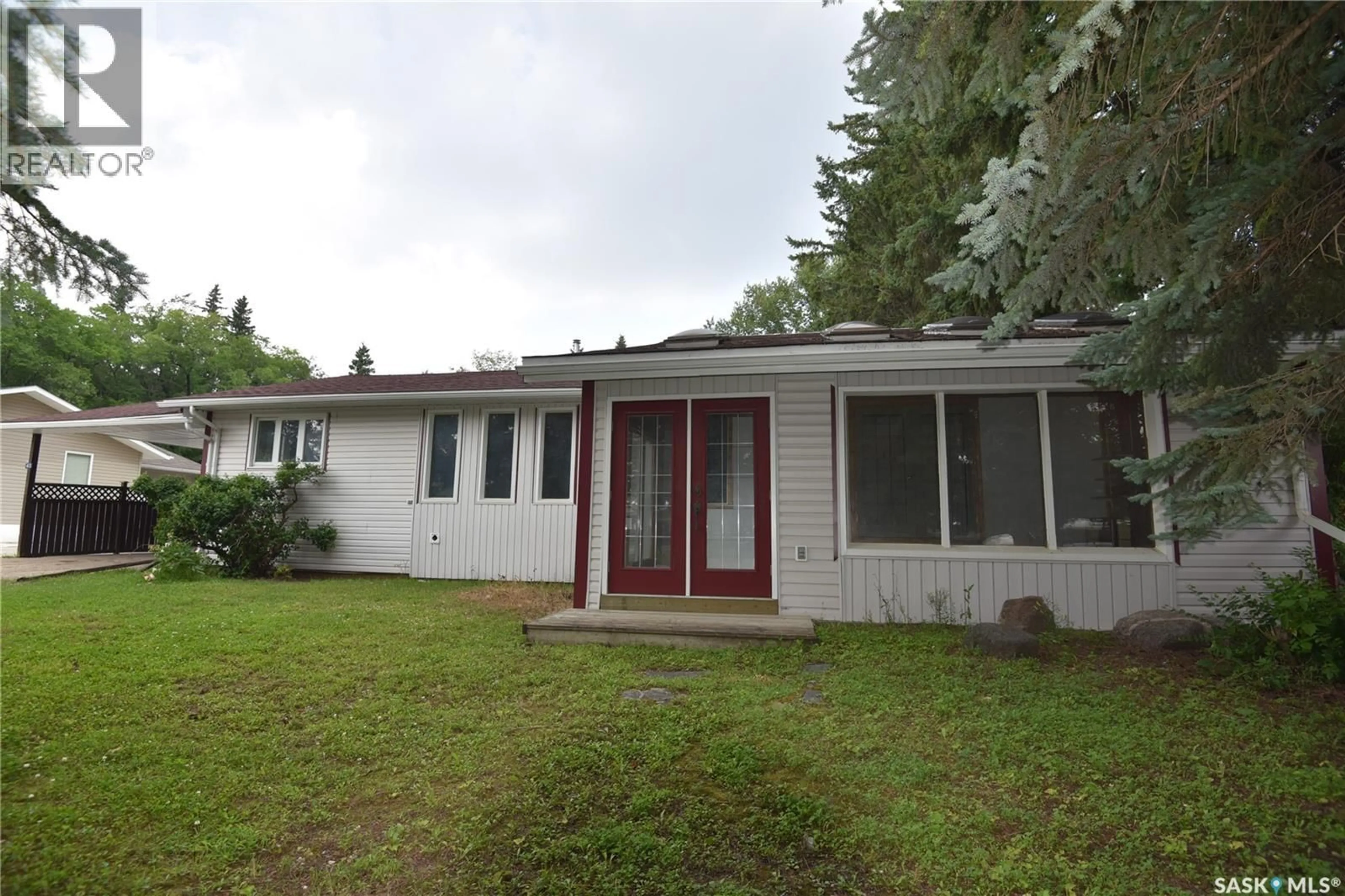 Home with vinyl exterior material, street for 413 MAPLE ROAD, Nipawin Saskatchewan S0E1E0