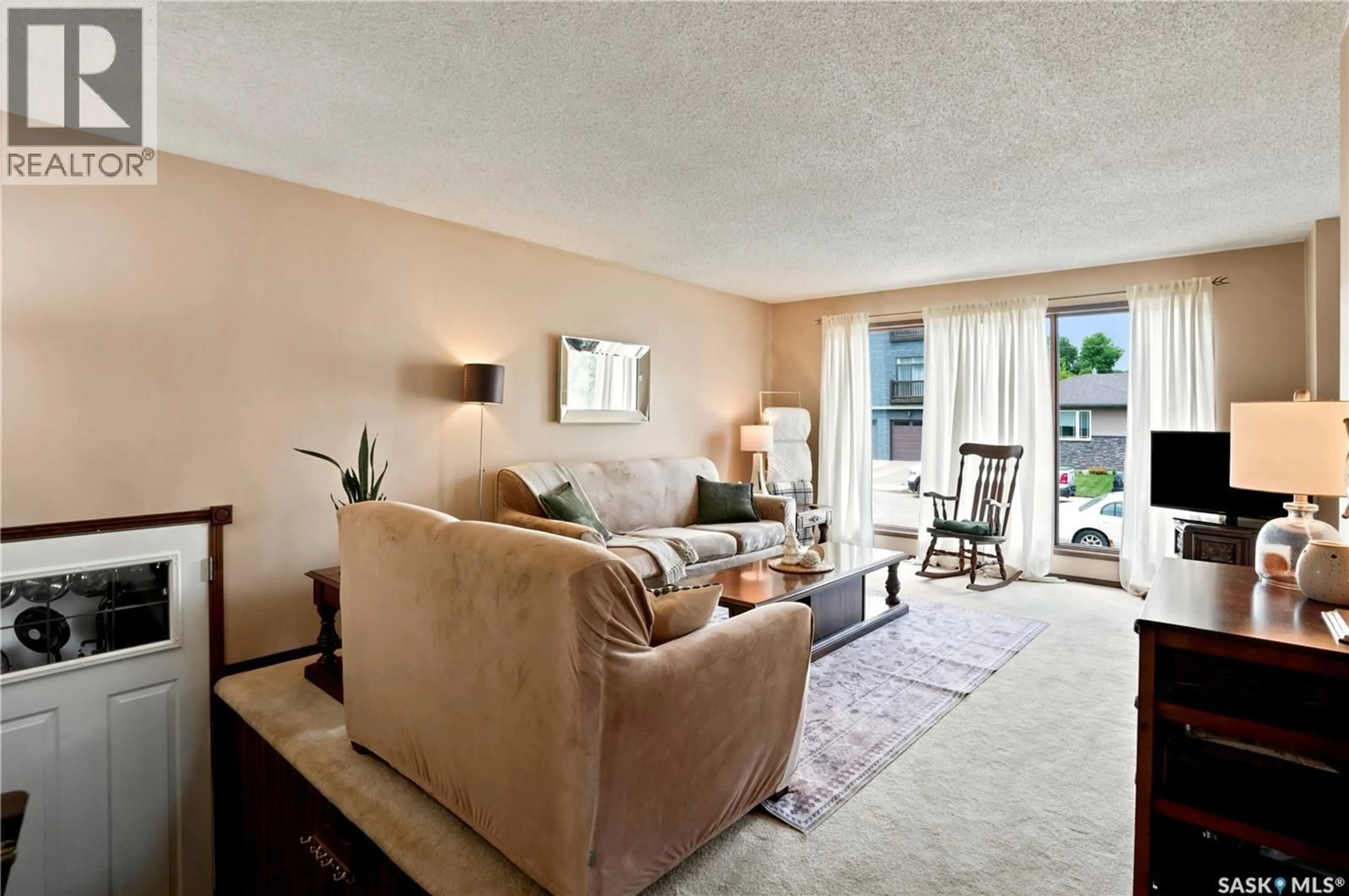 Living room with furniture, carpet floor for 933 MONTGOMERY STREET, Moose Jaw Saskatchewan S6H2W7