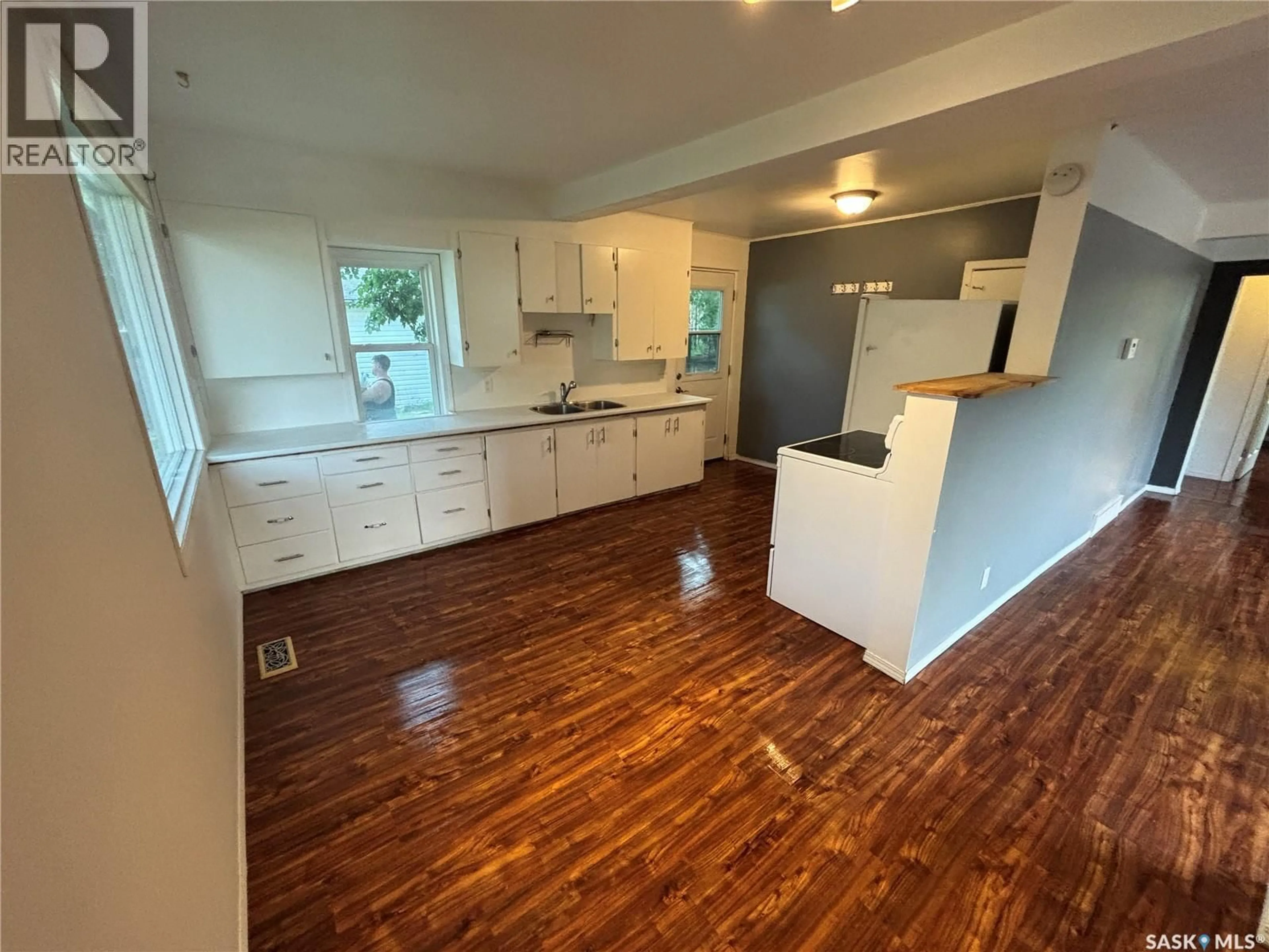 Open concept kitchen, wood/laminate floor for 501 4TH STREET, Meadow Lake Saskatchewan S9X1B9