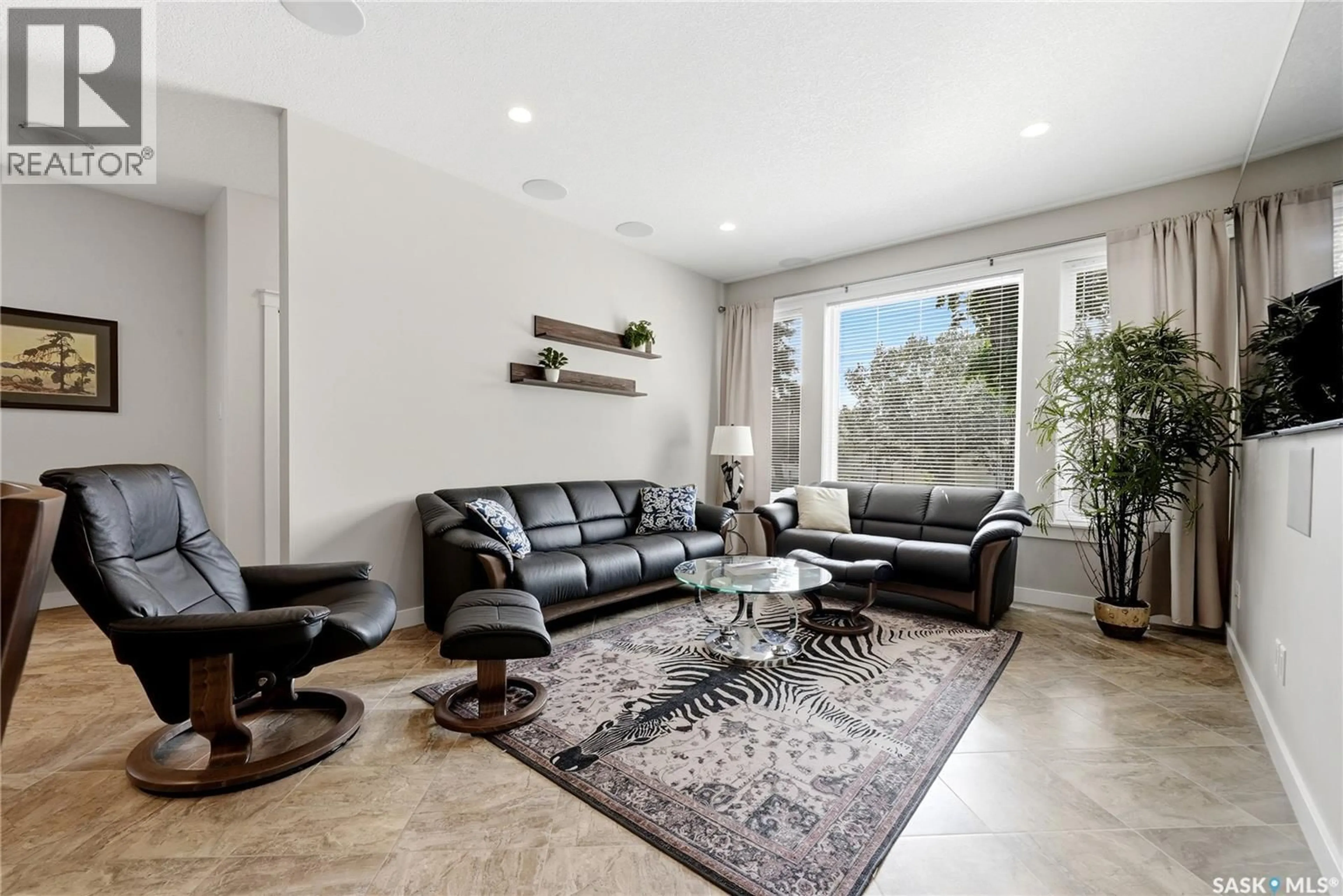Living room with furniture, ceramic/tile floor for 2871 GARNET STREET, Regina Saskatchewan S4S1X1