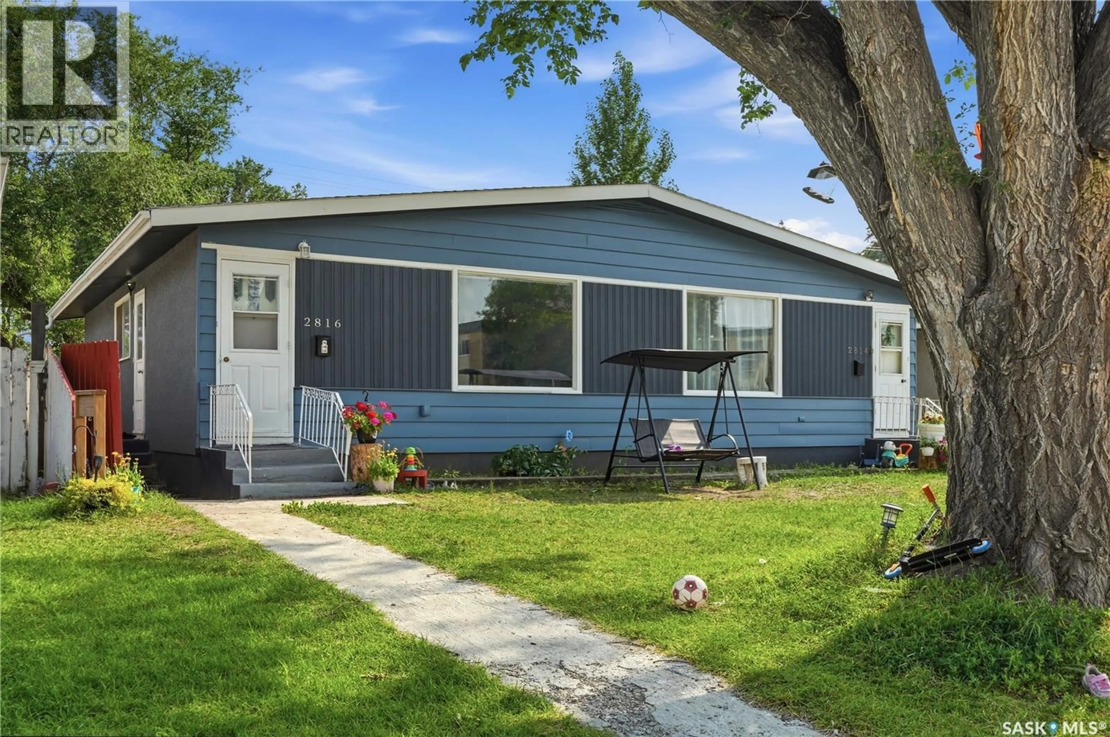 Home with vinyl exterior material, street for 2814-2816 7TH STREET, Saskatoon Saskatchewan S7H1B3
