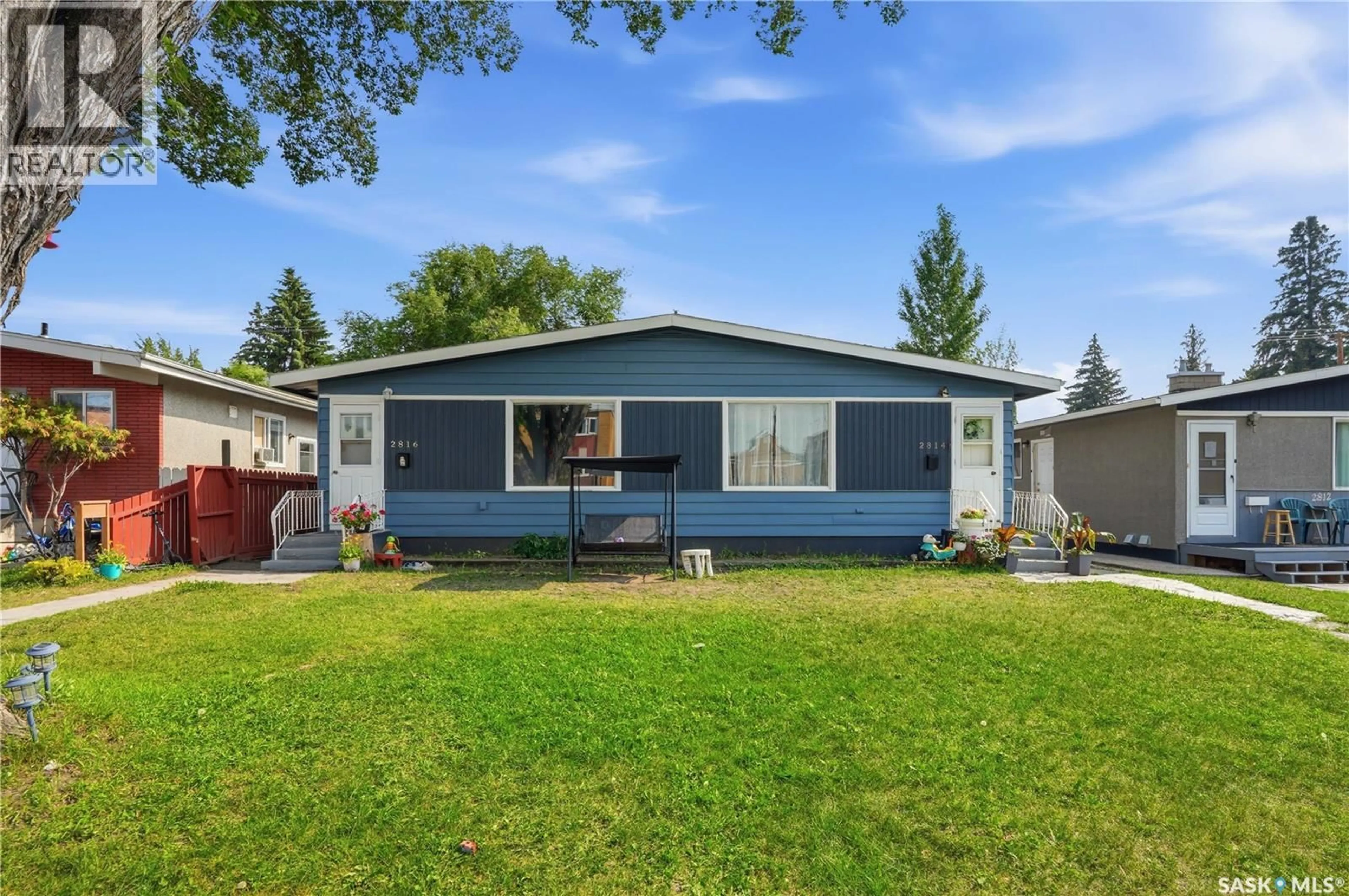 Home with vinyl exterior material, street for 2814-2816 7TH STREET, Saskatoon Saskatchewan S7H1B3