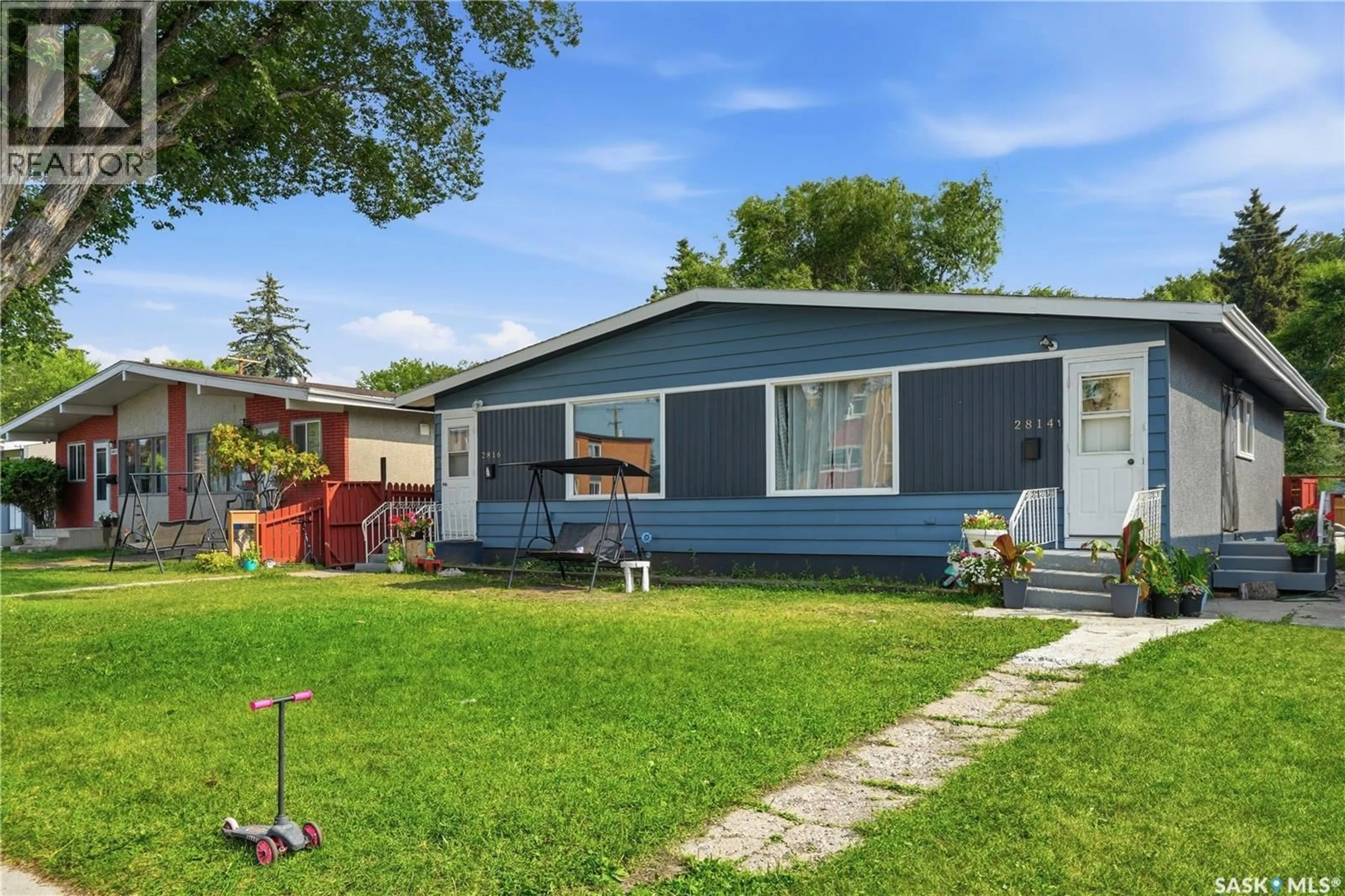 Home with vinyl exterior material, street for 2814-2816 7TH STREET, Saskatoon Saskatchewan S7H1B3