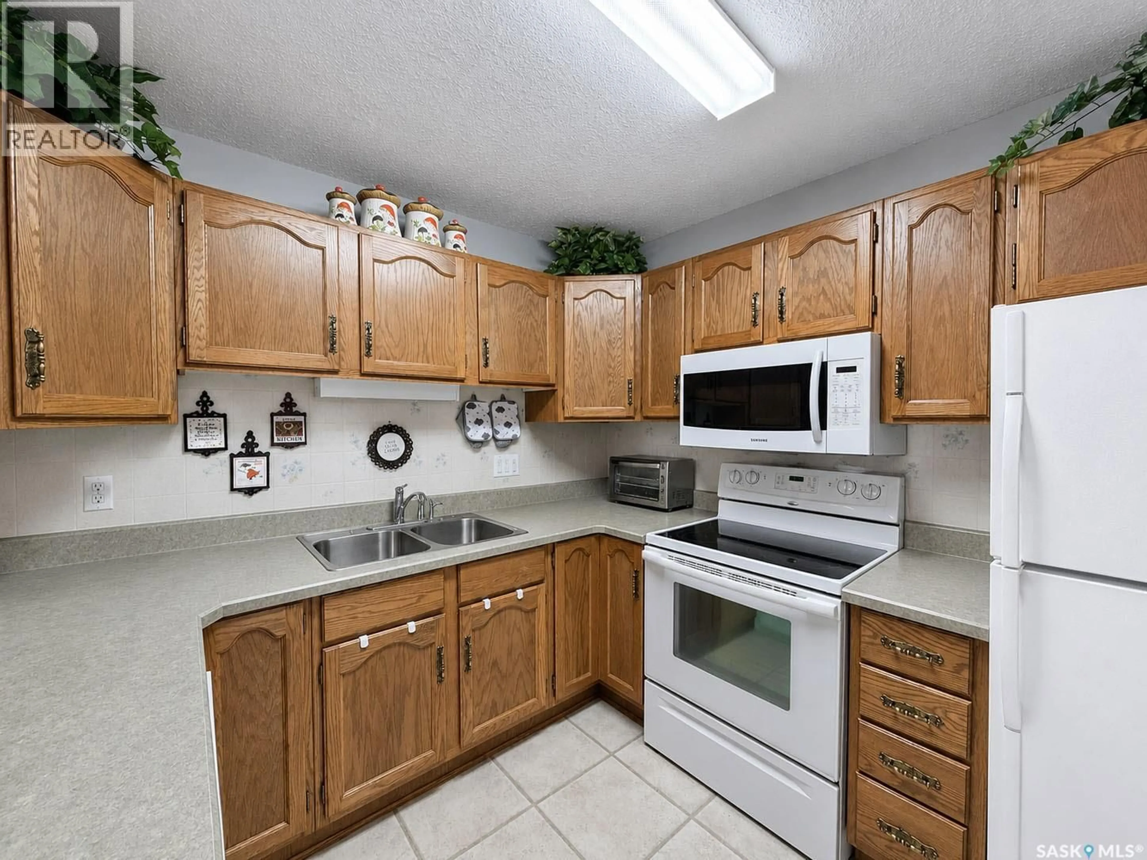 Standard kitchen, ceramic/tile floor for E - 304 255 7TH STREET, Prince Albert Saskatchewan S6V0R9