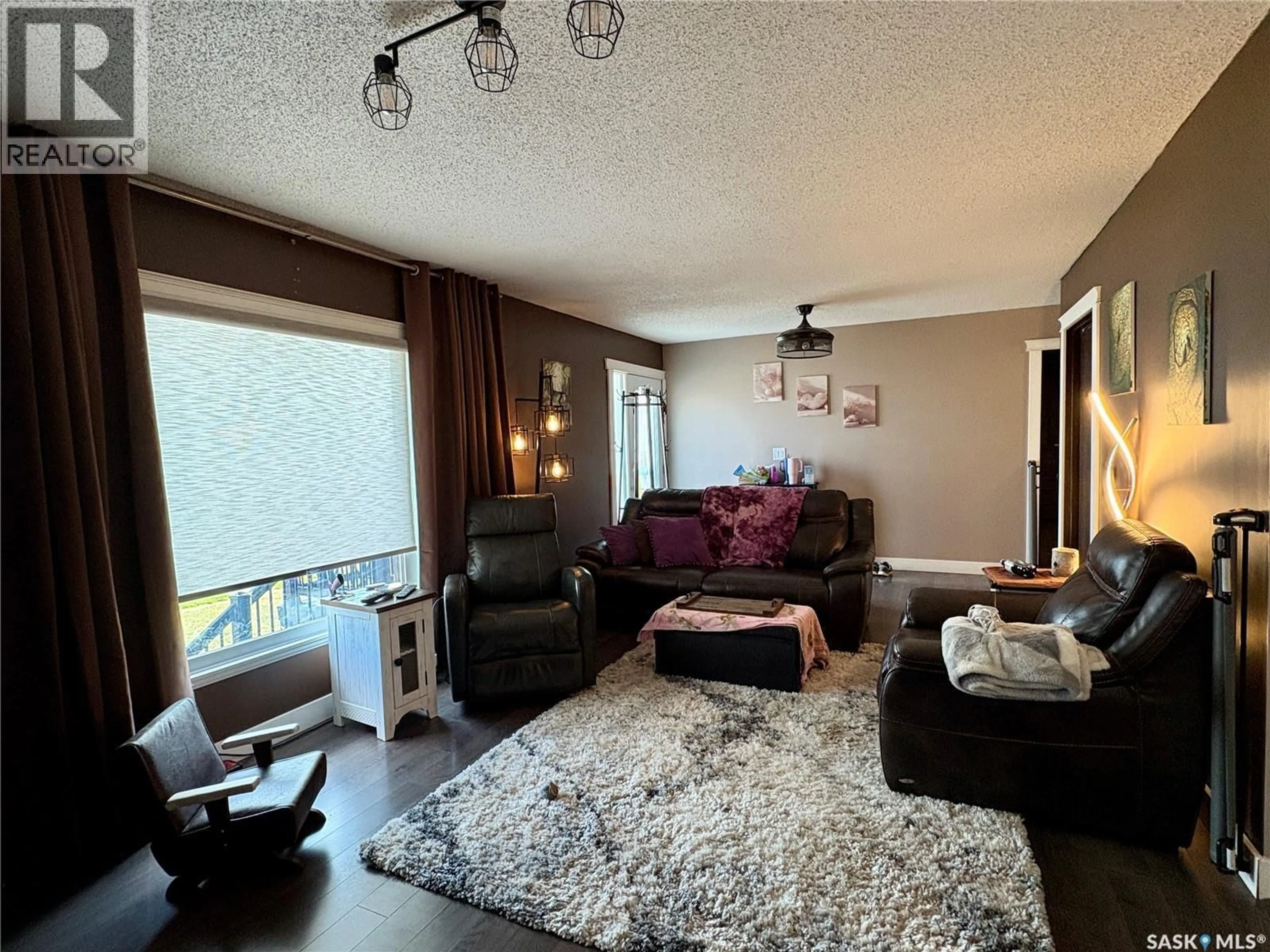 Living room with furniture, unknown for 105 5TH AVENUE, Hodgeville Saskatchewan S0H2B0