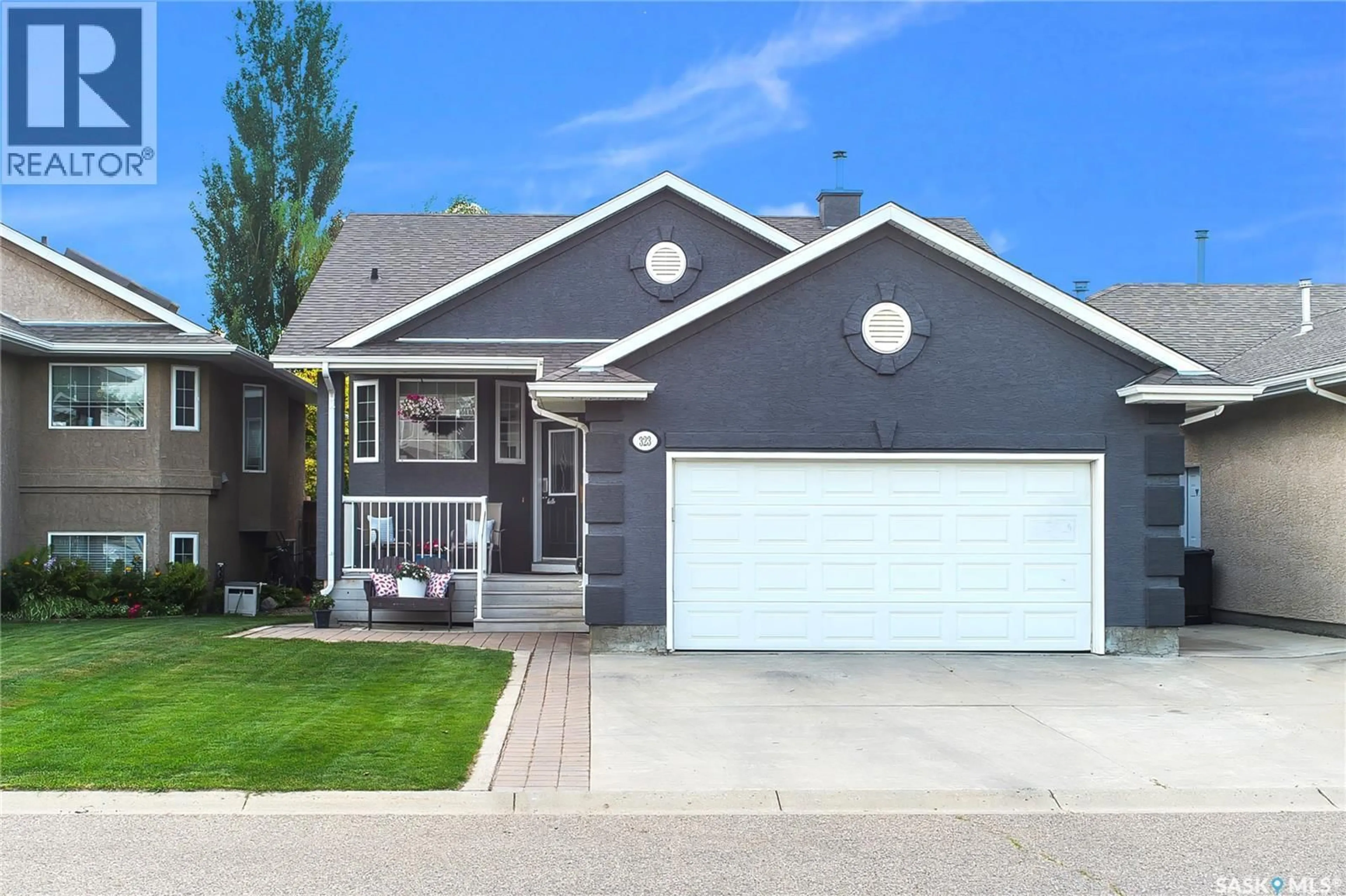 Home with vinyl exterior material, street for 323 PETERS COVE, Saskatoon Saskatchewan S7N4T5