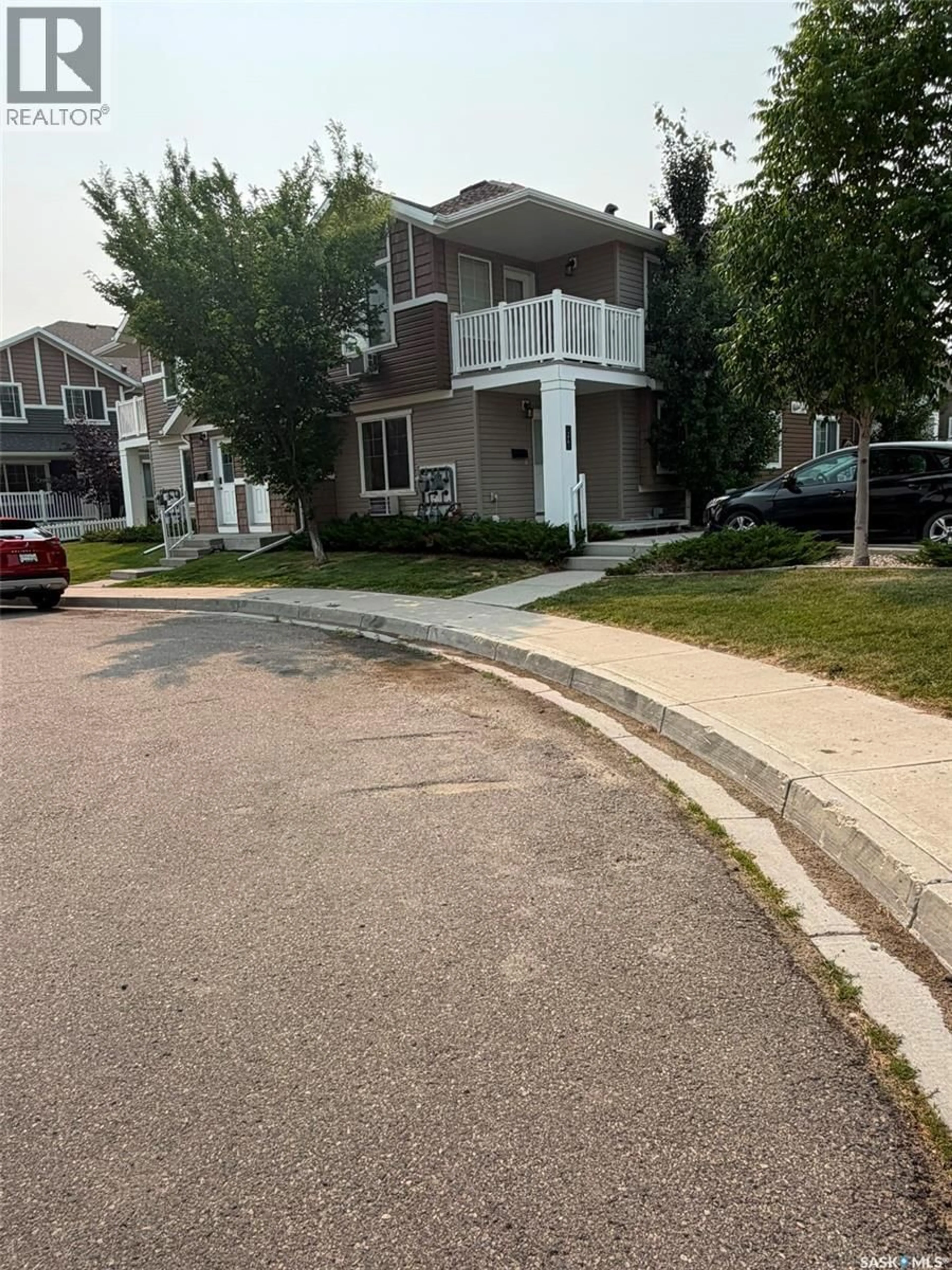 A pic from outside/outdoor area/front of a property/back of a property/a pic from drone, street for 26 - 5742 GORDON ROAD, Regina Saskatchewan S4W0M1