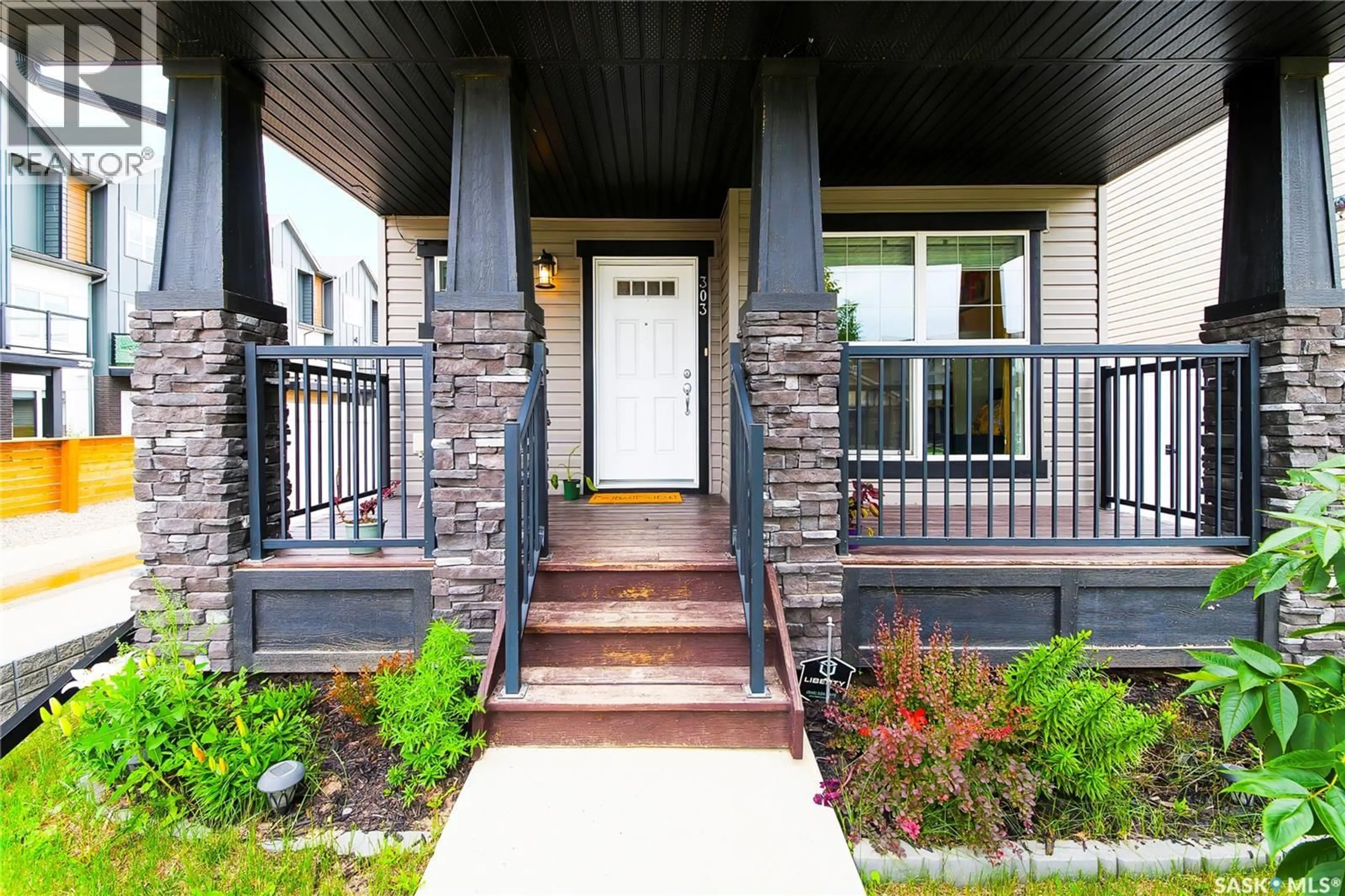 Home with brick exterior material, street for 303 DELAINEY MANOR, Saskatoon Saskatchewan S7V0N4