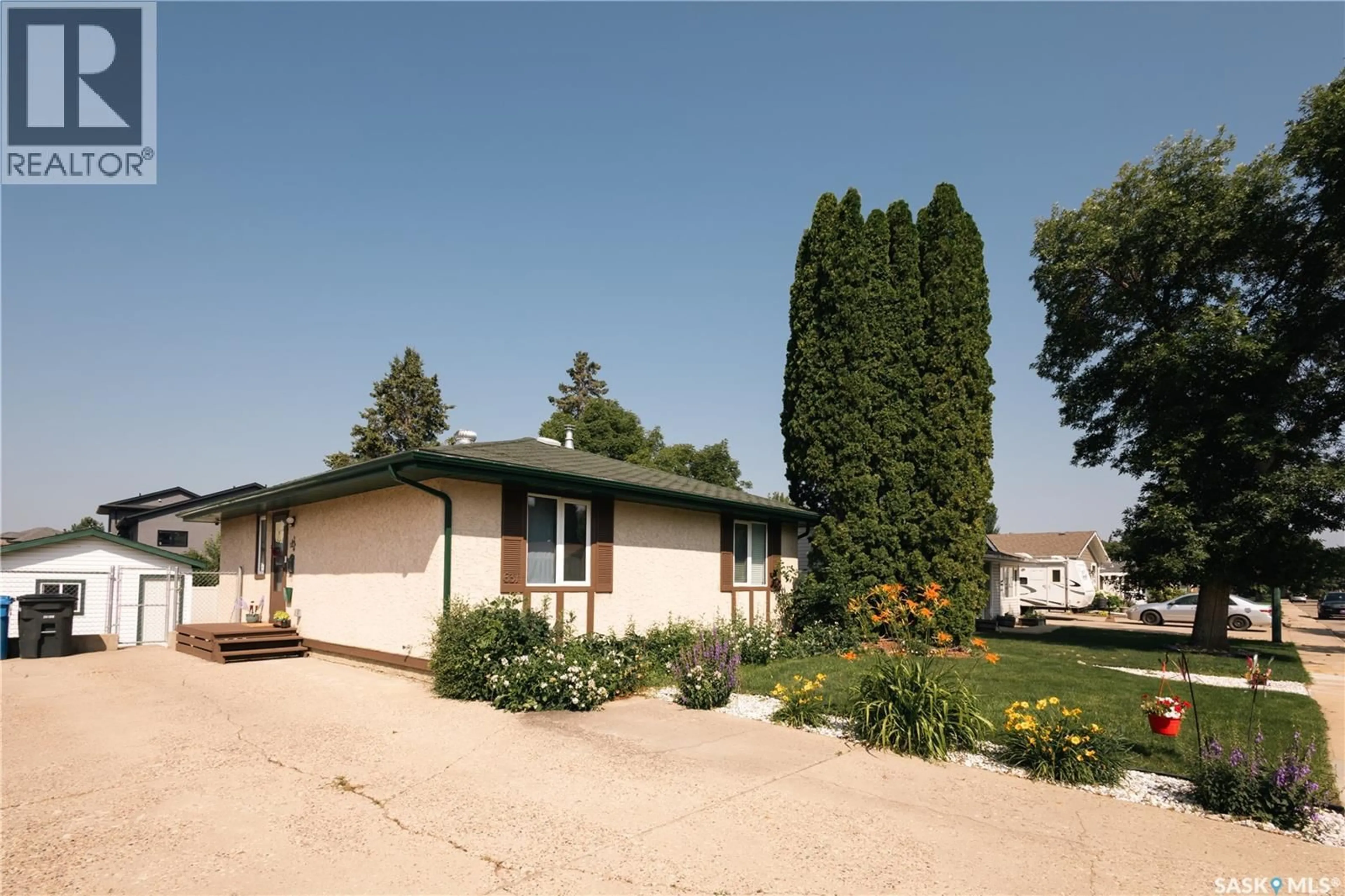 Home with vinyl exterior material, street for 631 BUCHANAN DRIVE, Prince Albert Saskatchewan S6V5Z7