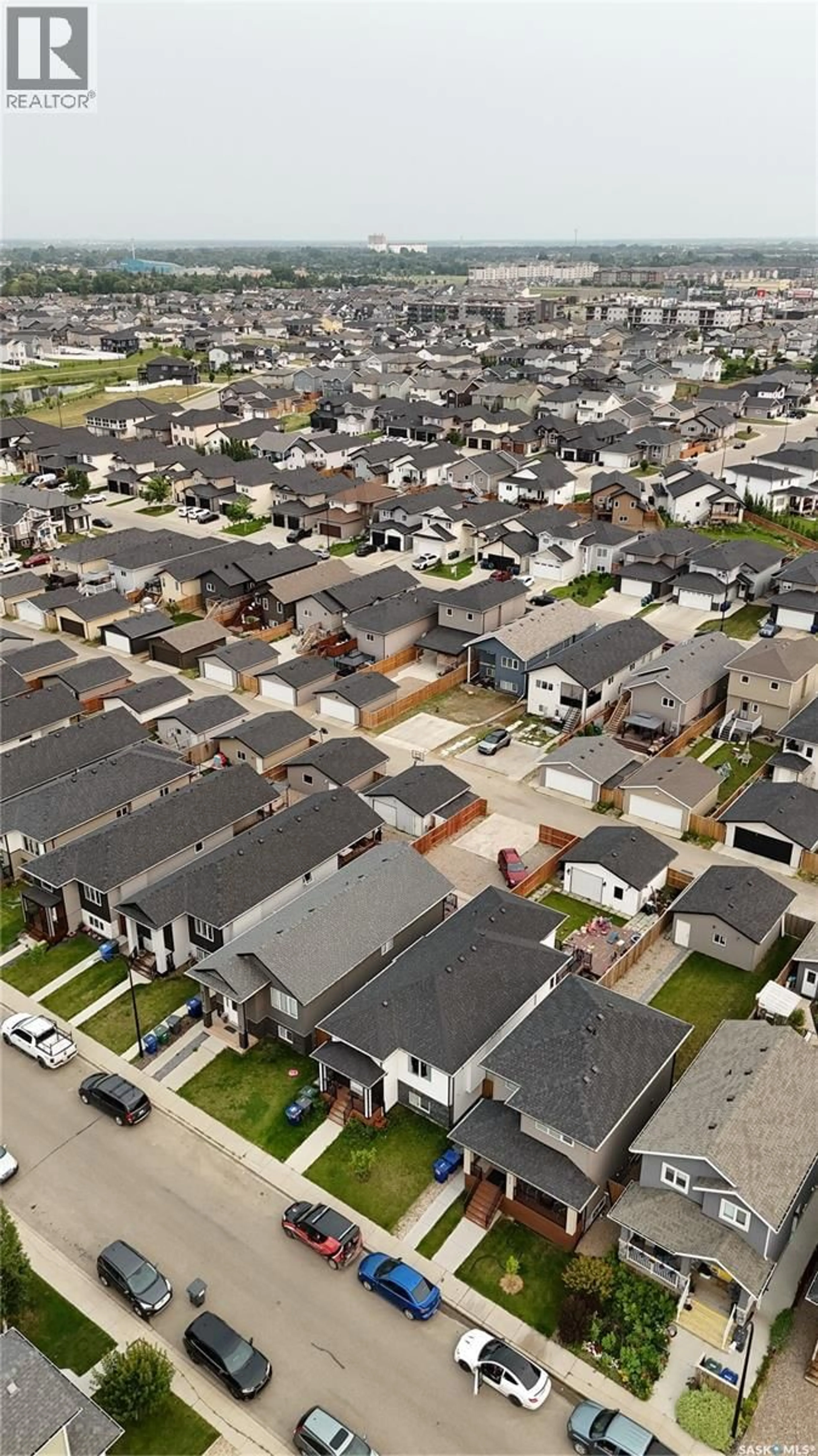 A pic from outside/outdoor area/front of a property/back of a property/a pic from drone, street for 418 ELLS WAY, Saskatoon Saskatchewan S7L6K6