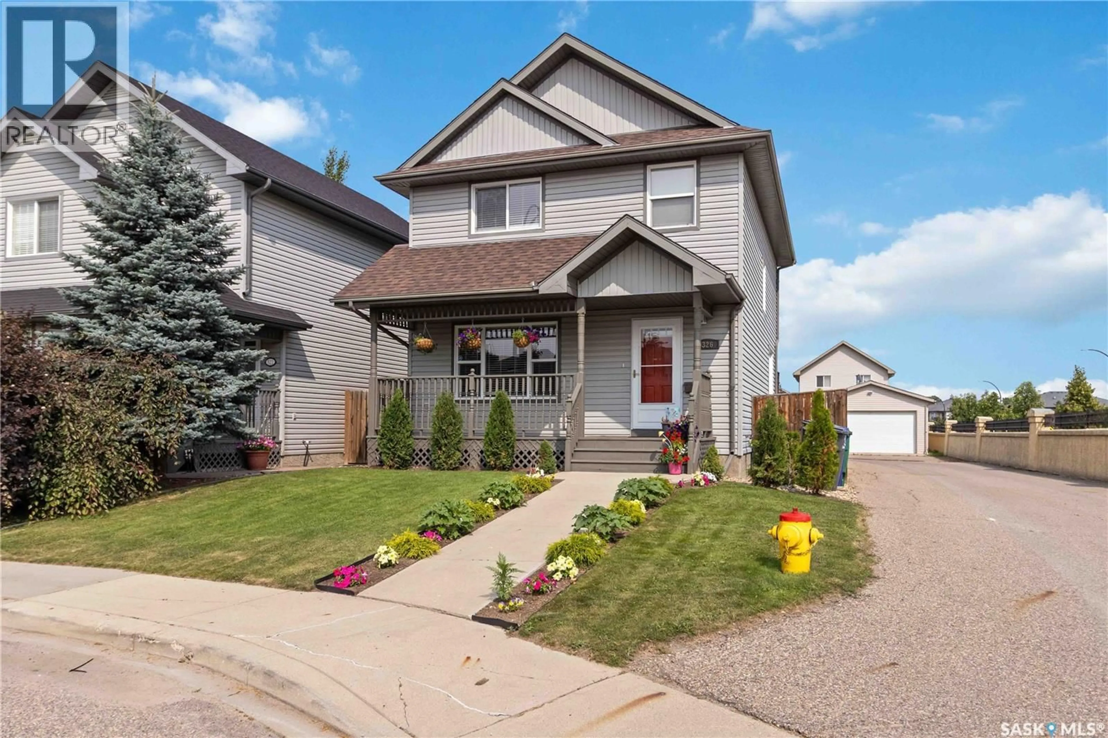 Home with vinyl exterior material, street for 326 DENHAM COURT, Saskatoon Saskatchewan S7R1E5