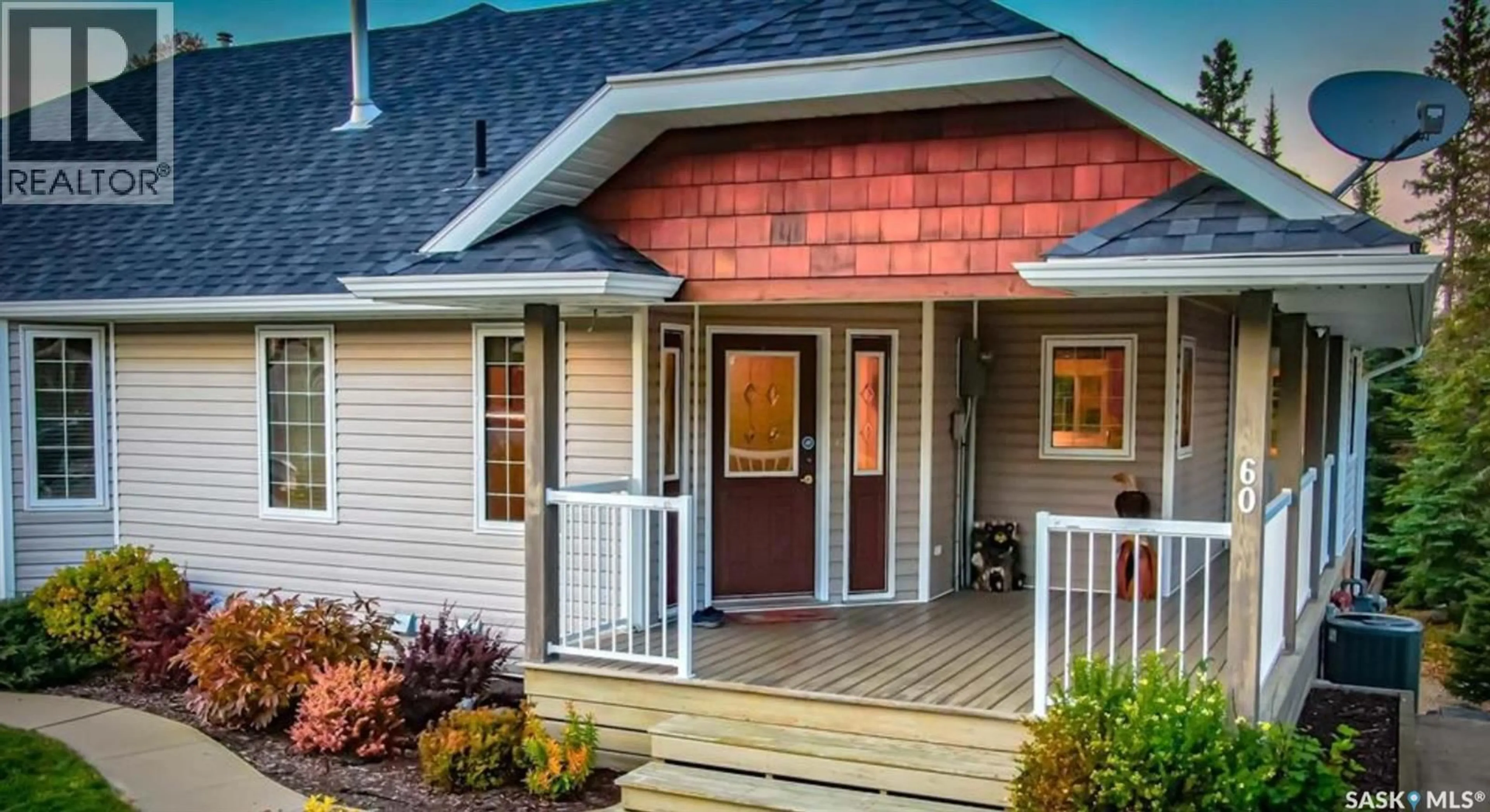 Home with vinyl exterior material, street for 60 ESTATES DRIVE, Elk Ridge Saskatchewan S0J0N0