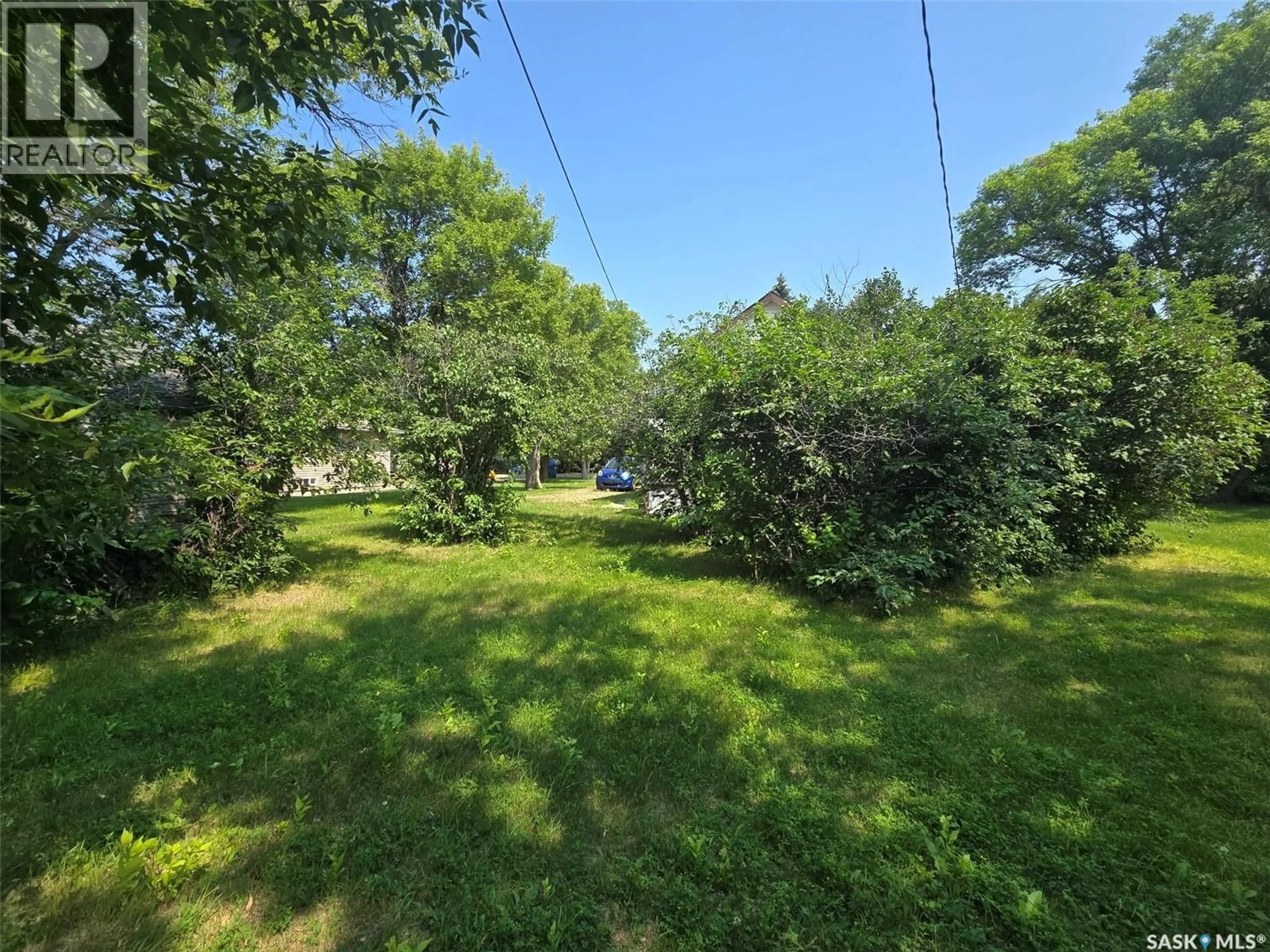 A pic from outside/outdoor area/front of a property/back of a property/a pic from drone, forest/trees view for 910 PACIFIC STREET, Grenfell Saskatchewan S0G2B0