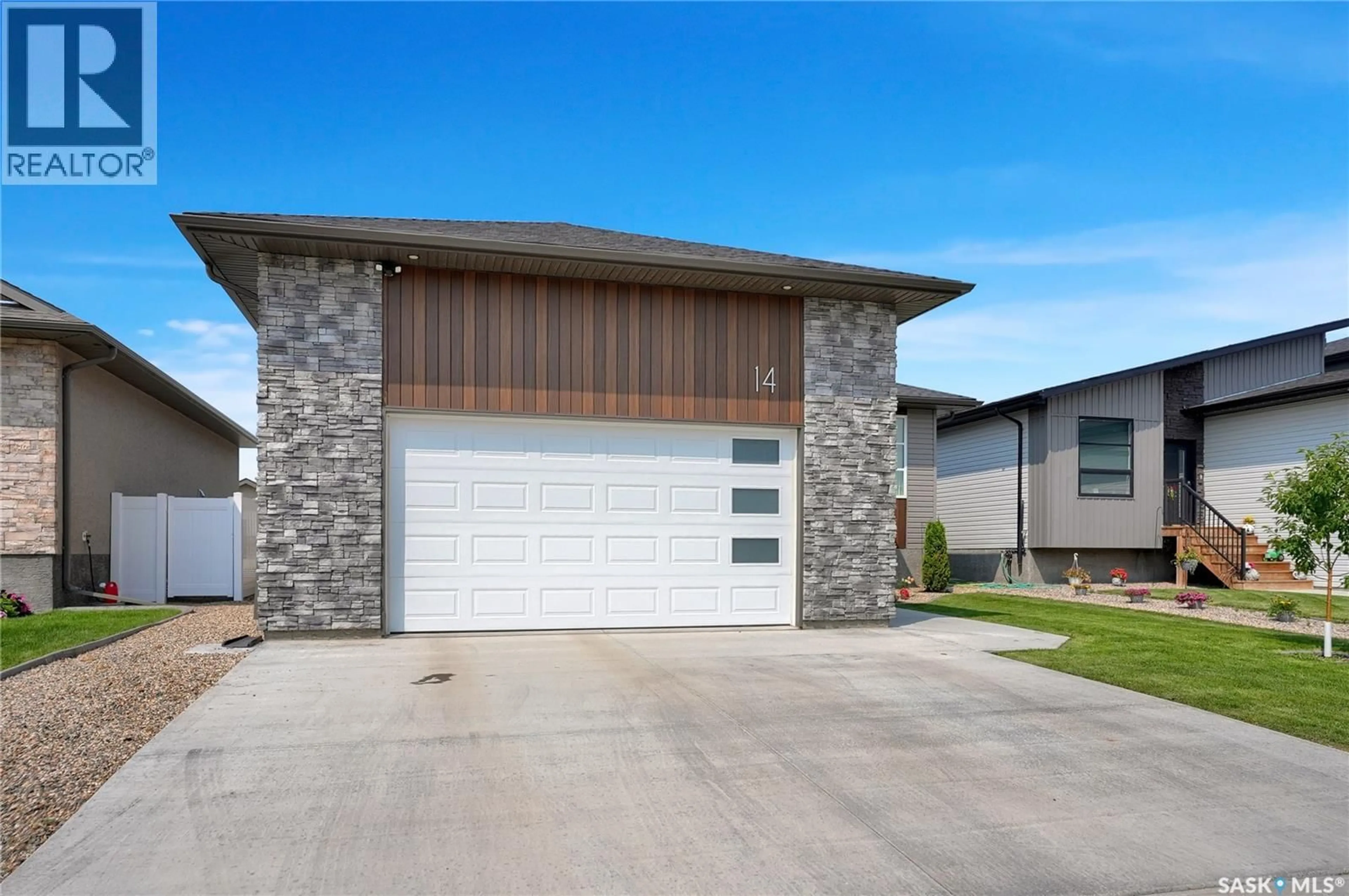 Home with brick exterior material, street for 14 CLUNIE COURT, Moose Jaw Saskatchewan S6J0E3