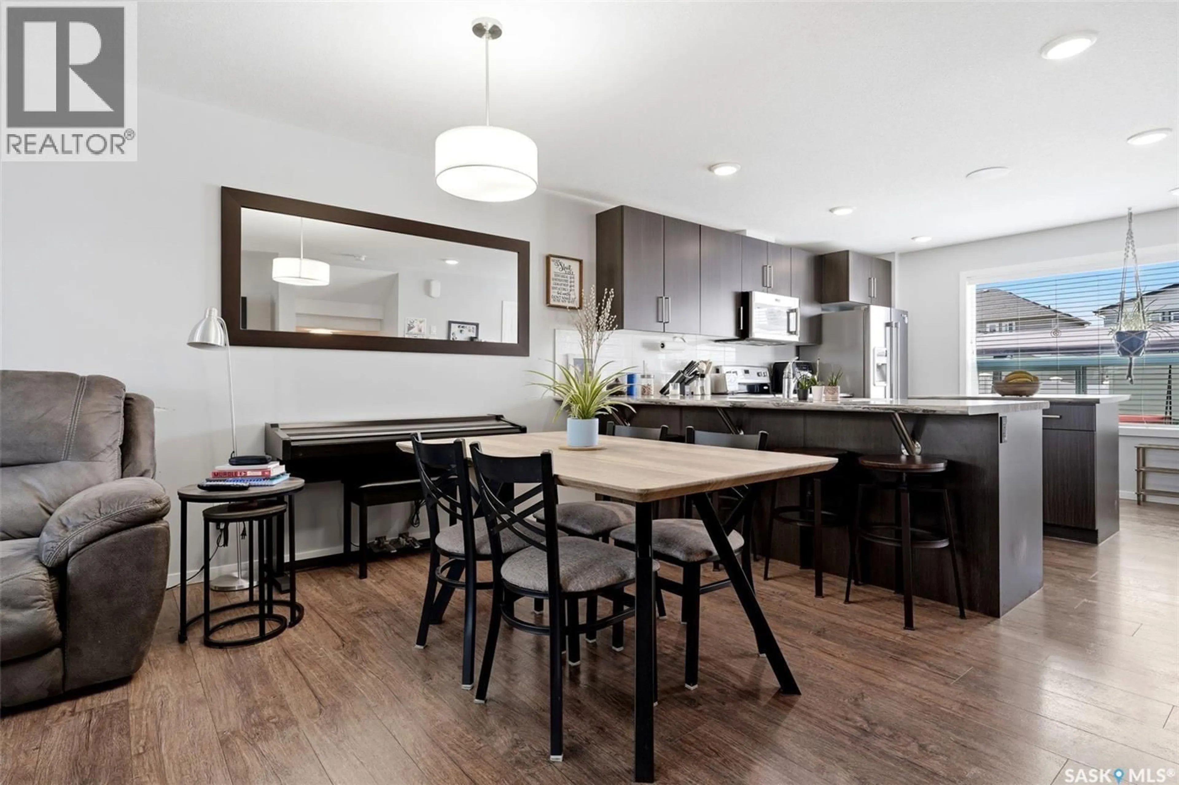 Open concept kitchen, wood/laminate floor for 5740 GLIDE CRESCENT, Regina Saskatchewan S4W0P1