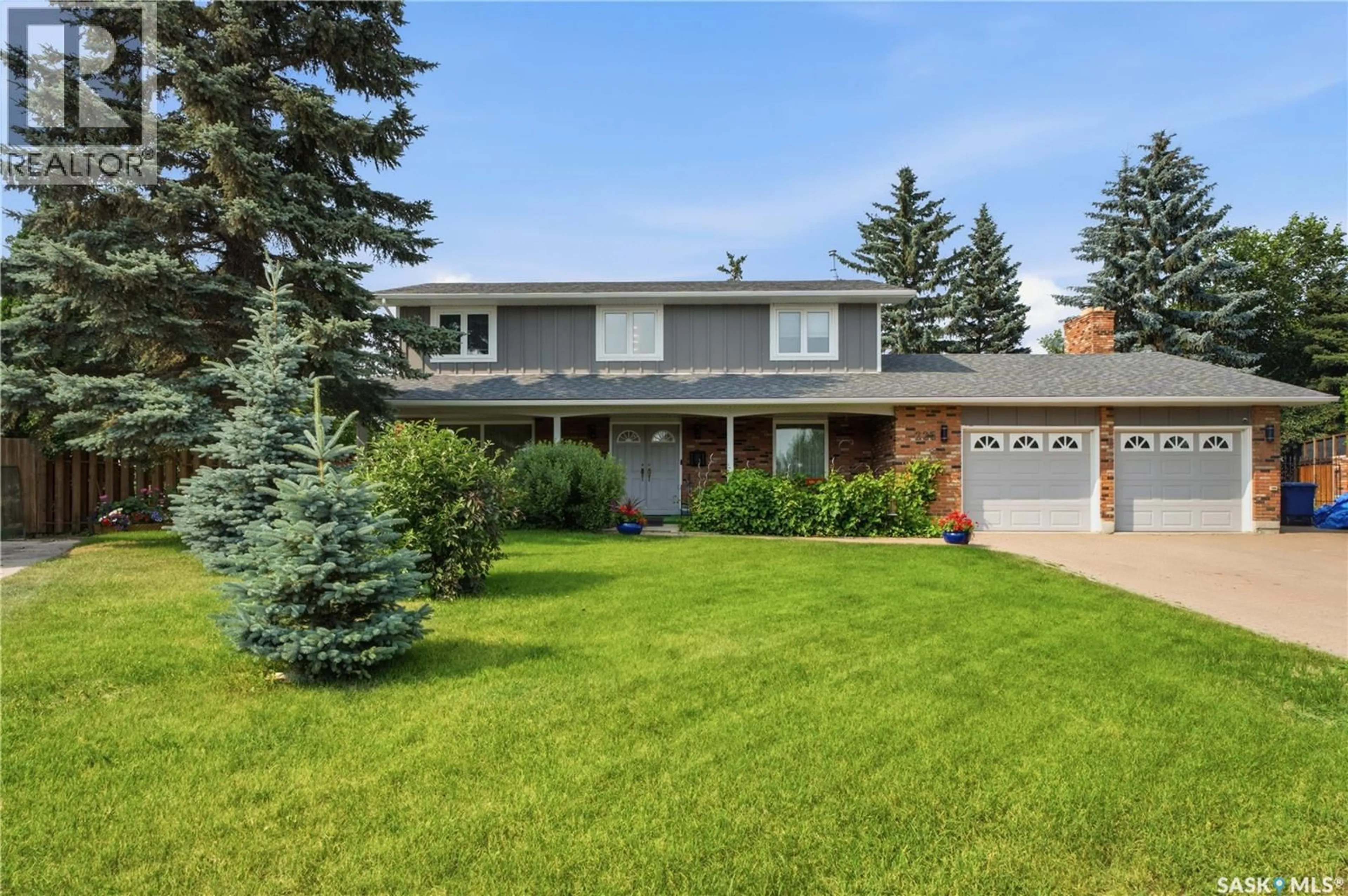Home with brick exterior material, street for 225 CLEARWATER COURT, Saskatoon Saskatchewan S7K3Y9