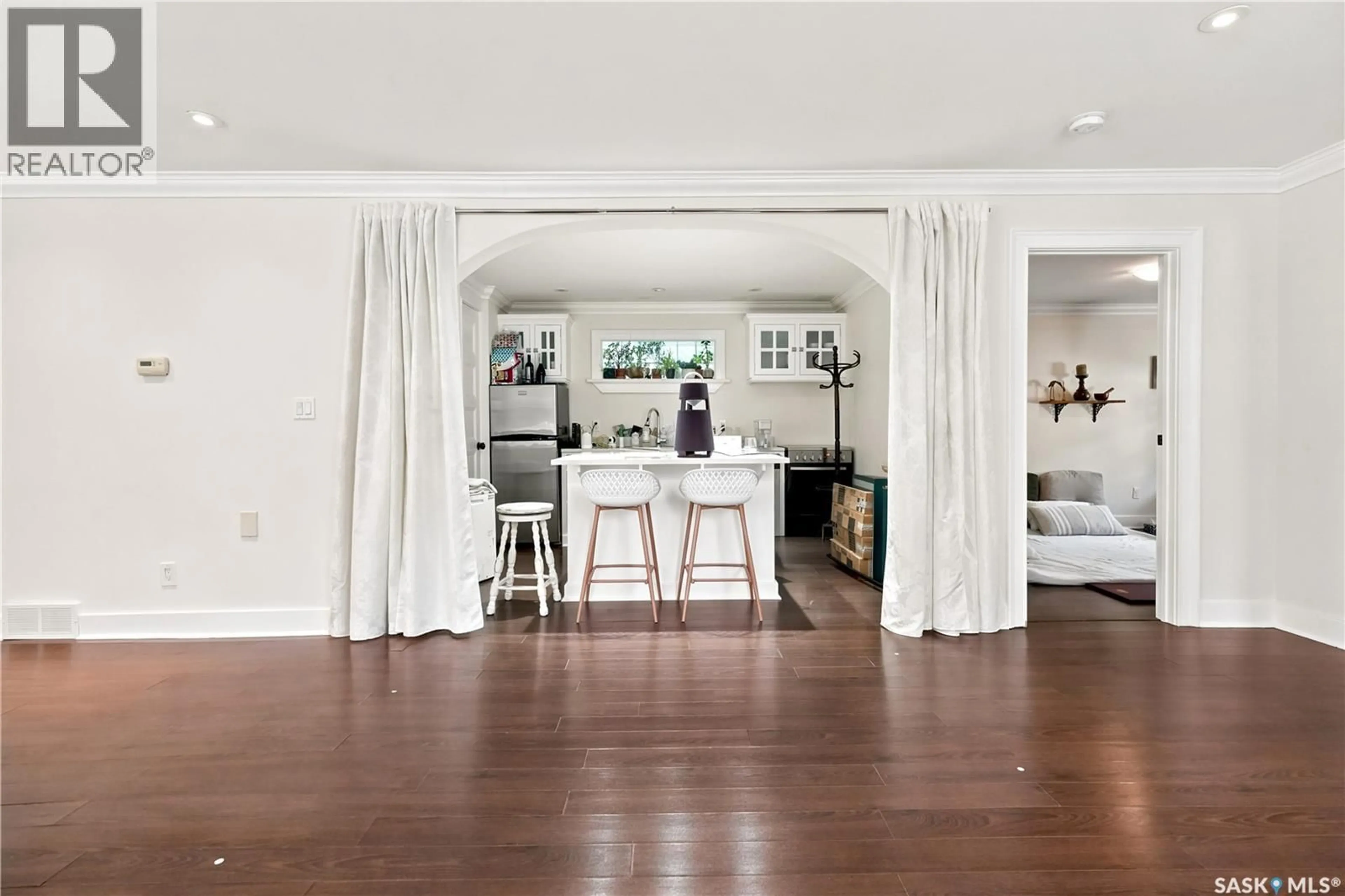 Open concept kitchen, wood/laminate floor for 2216 LORNE STREET, Regina Saskatchewan S4P2M7