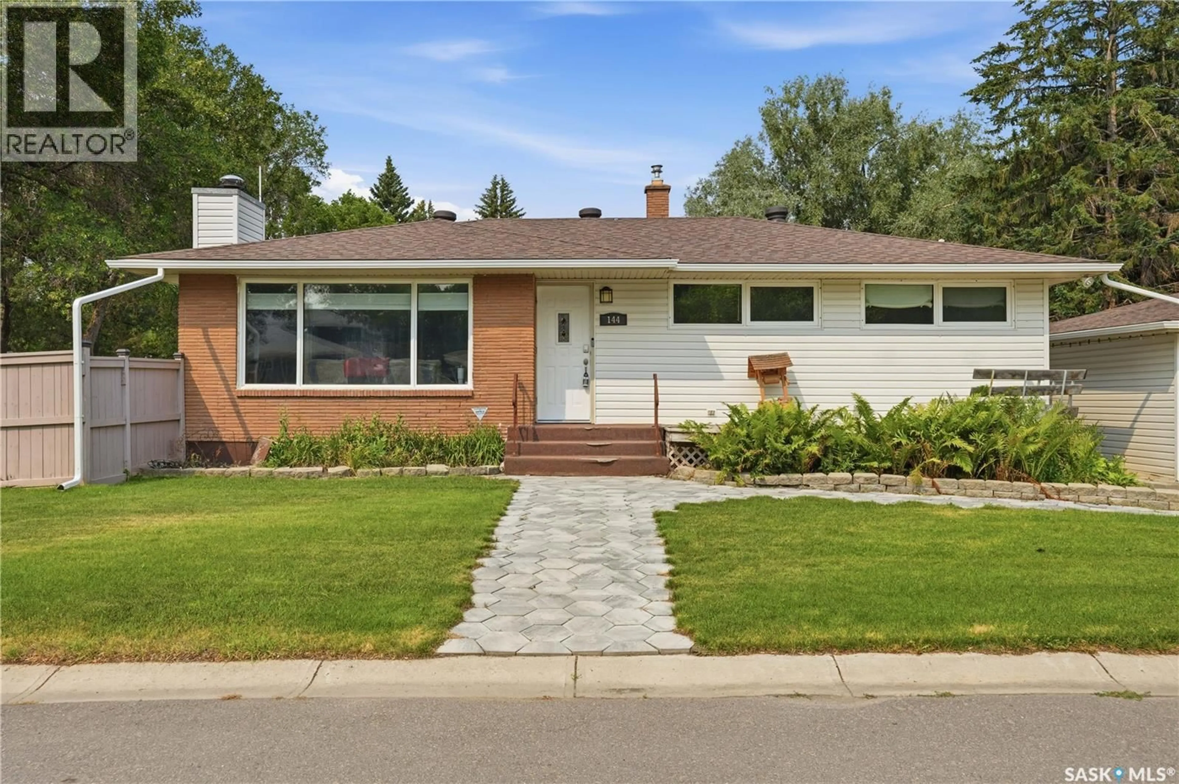 Home with brick exterior material, street for 144 ORCHARD CRESCENT, Regina Saskatchewan S4S5B6