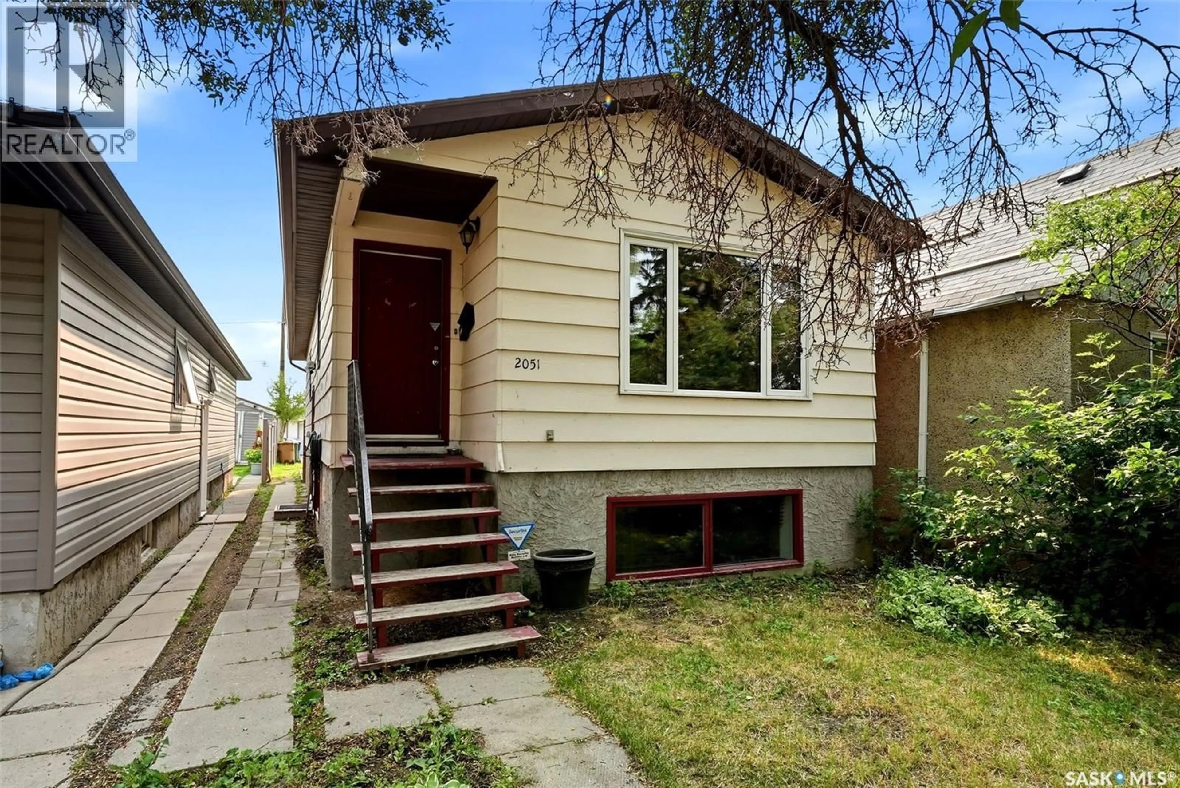 Home with vinyl exterior material, street for 2051 MCDONALD STREET, Regina Saskatchewan S4N2Y4