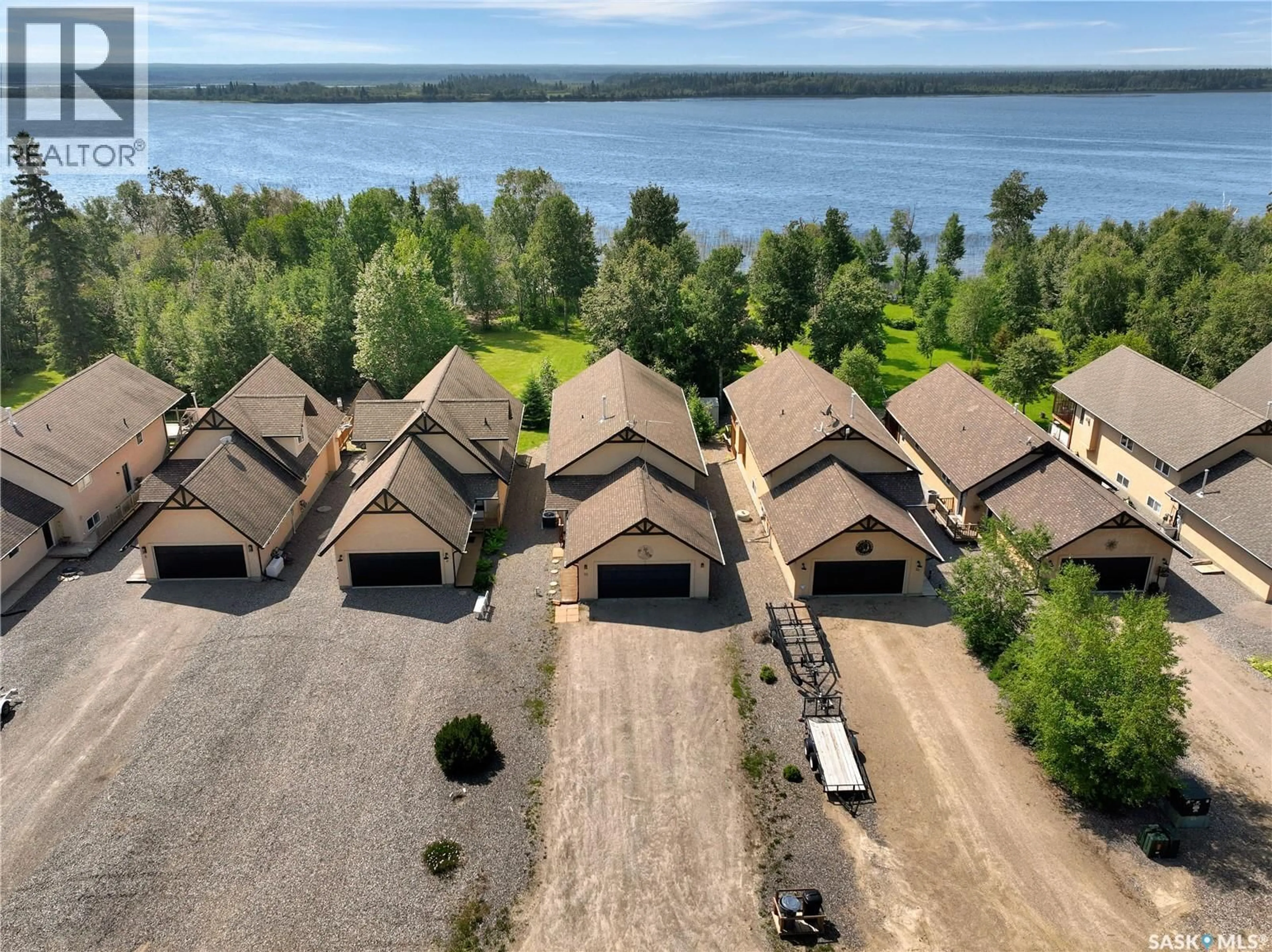 A pic from outside/outdoor area/front of a property/back of a property/a pic from drone, water/lake/river/ocean view for 10 SUNSET WAY, Candle Lake Saskatchewan S0J3E0
