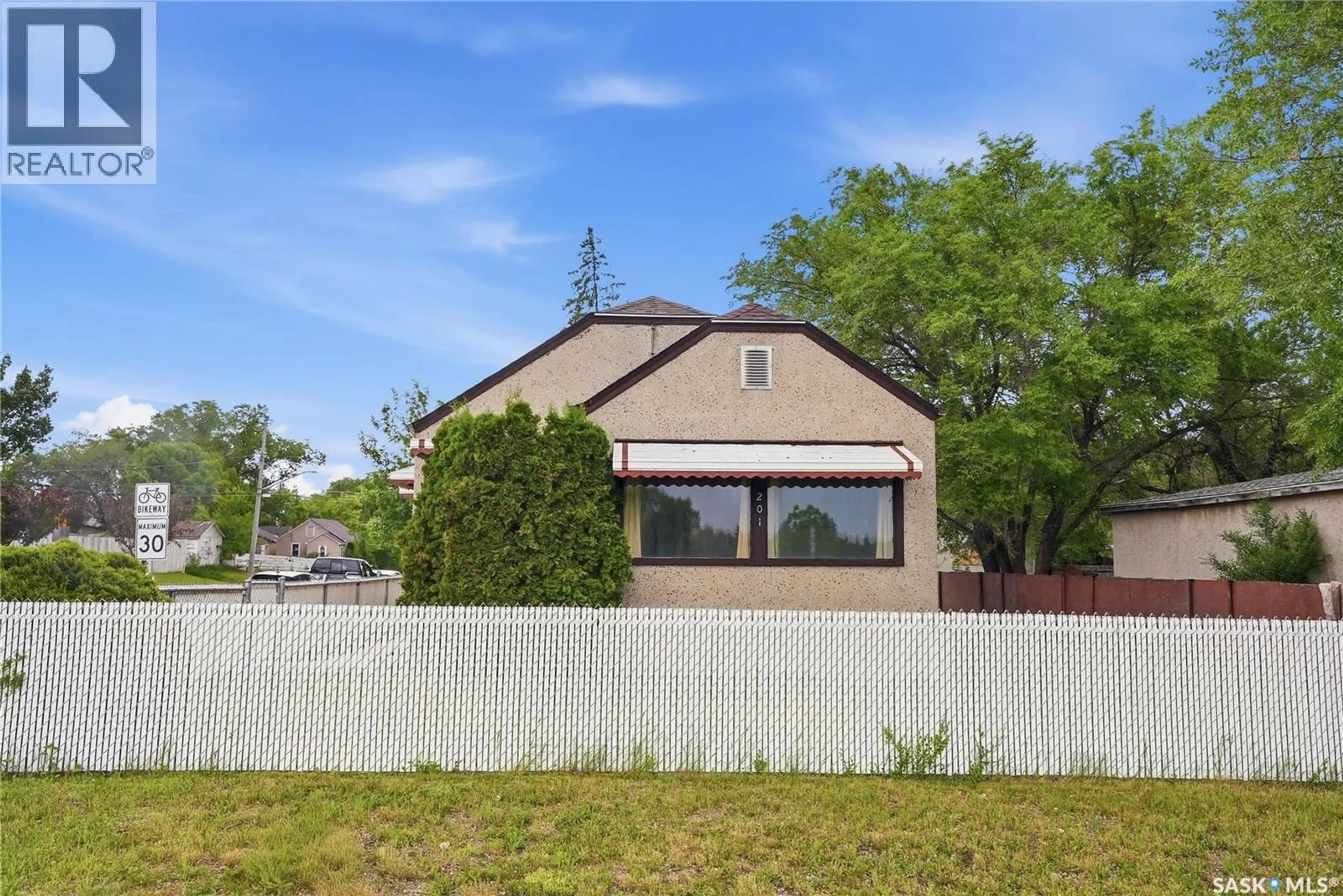 Home with vinyl exterior material, street for 201 P AVENUE, Saskatoon Saskatchewan S7L2V6