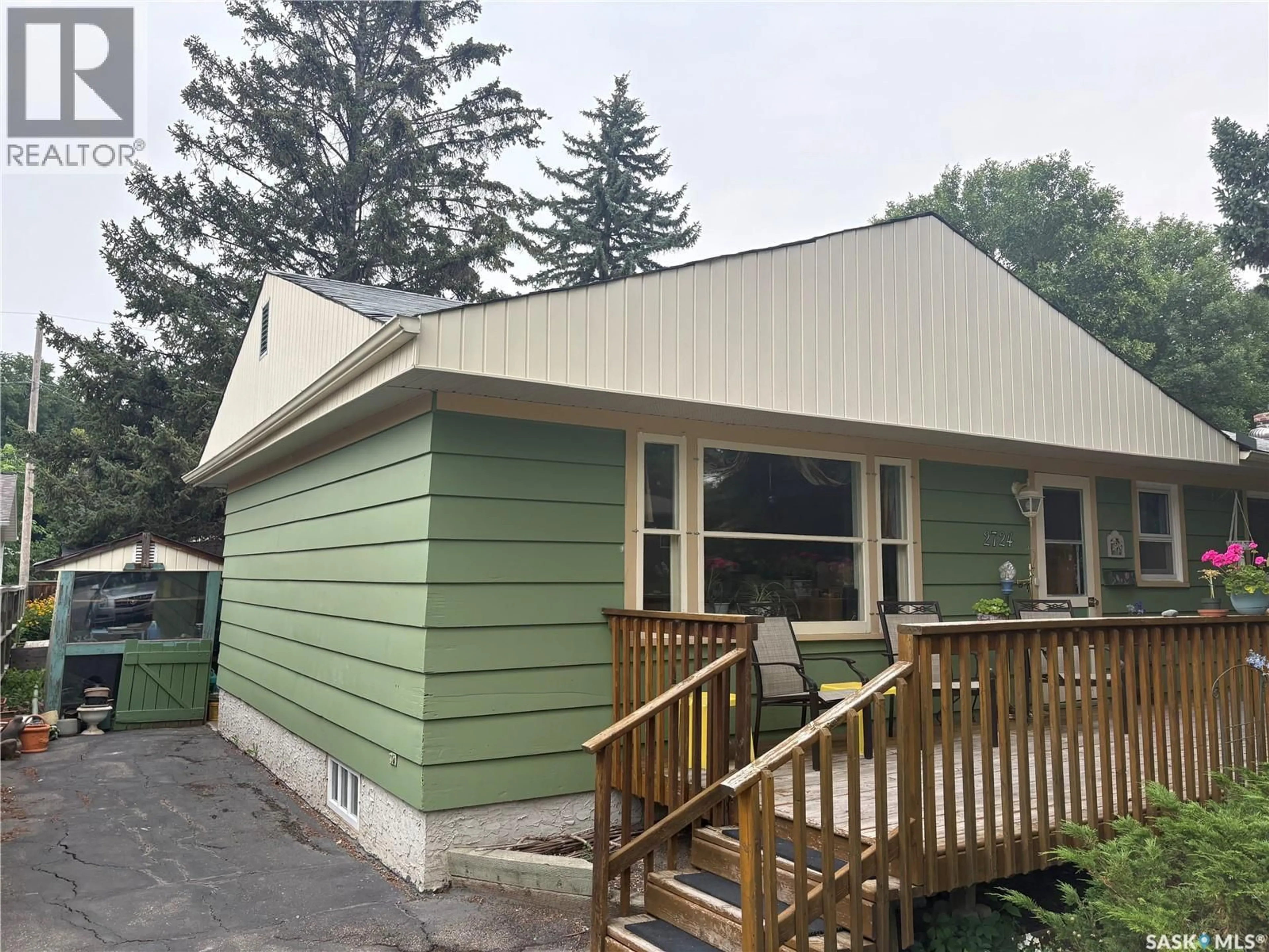 Home with vinyl exterior material, street for 2724 24TH AVENUE, Regina Saskatchewan S4S1J5