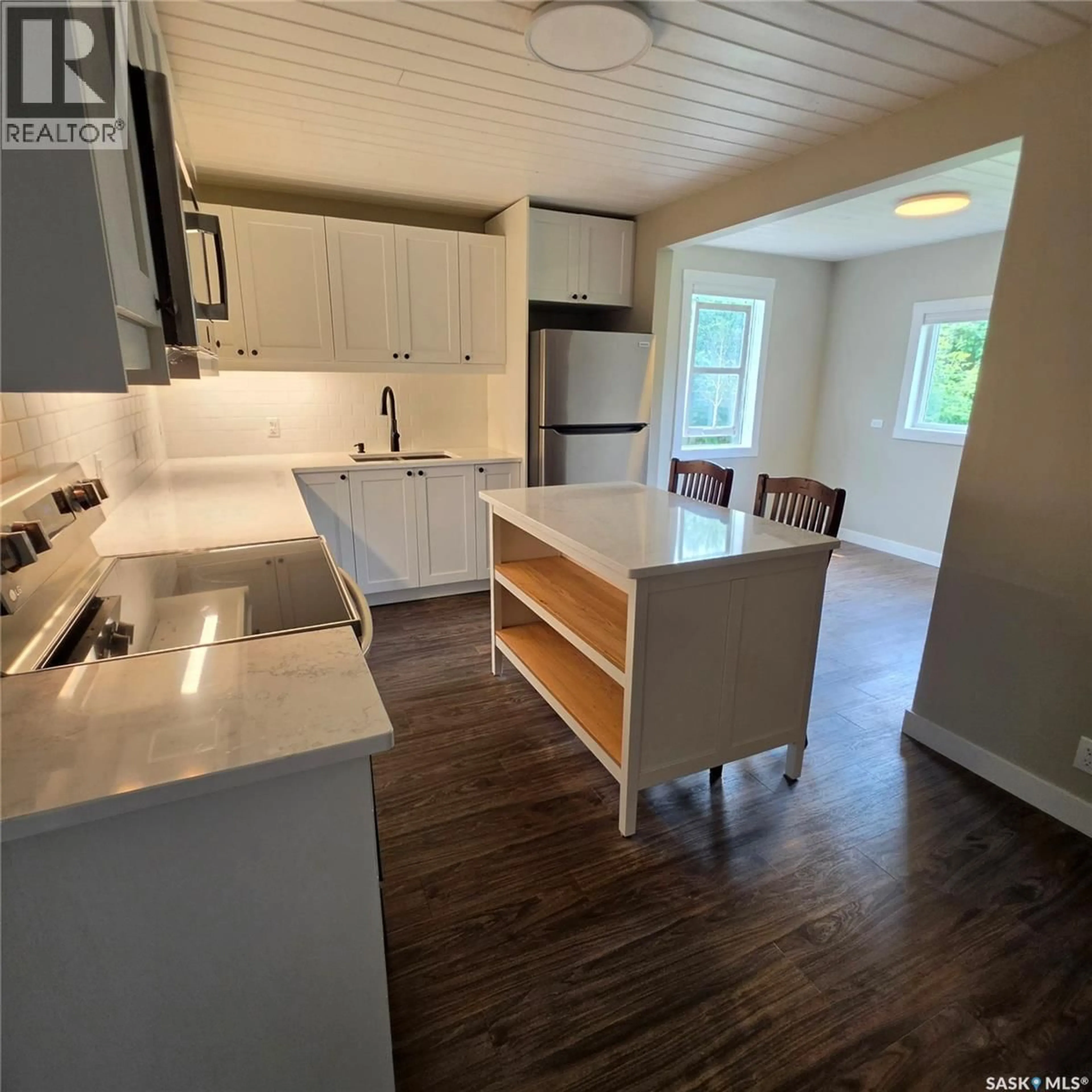 Open concept kitchen, wood/laminate floor for 223 3RD STREET, Preeceville Saskatchewan S0A3B0
