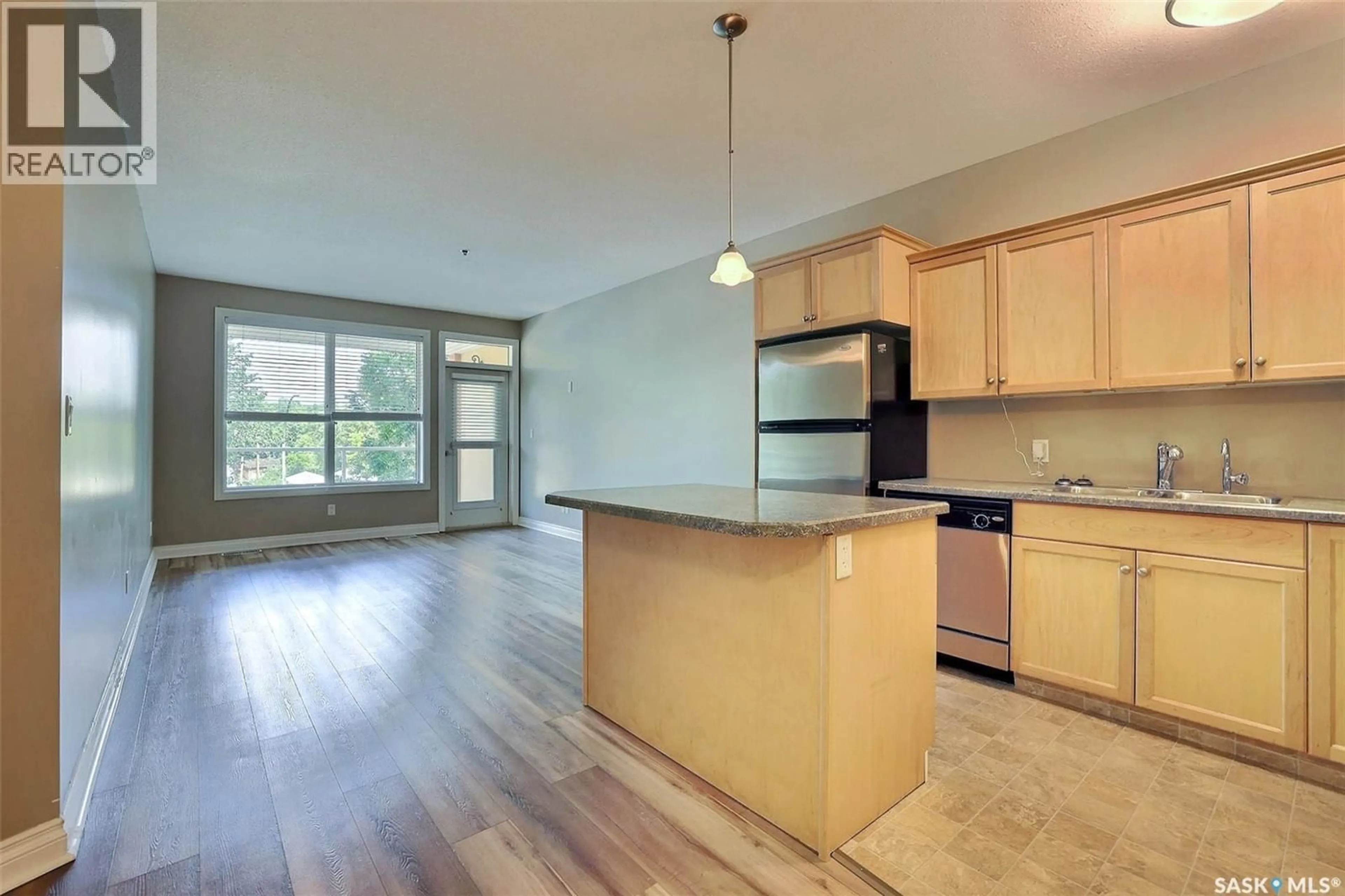 Open concept kitchen, wood/laminate floor for 306 - 2700 MONTAGUE STREET, Regina Saskatchewan S4S0J9