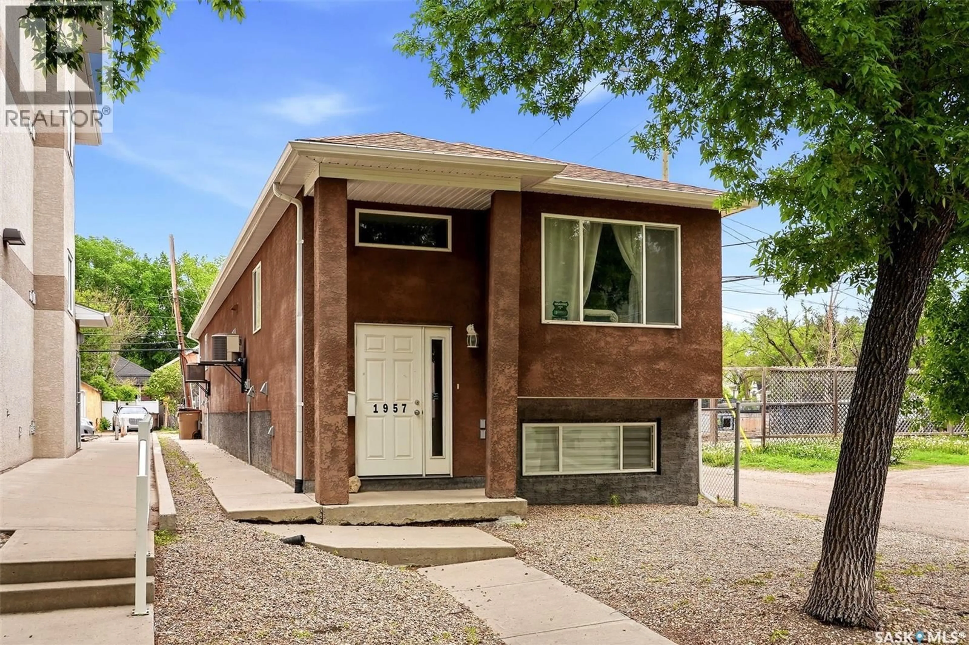 Home with brick exterior material, street for 1957 HALIFAX STREET, Regina Saskatchewan S4P1T6