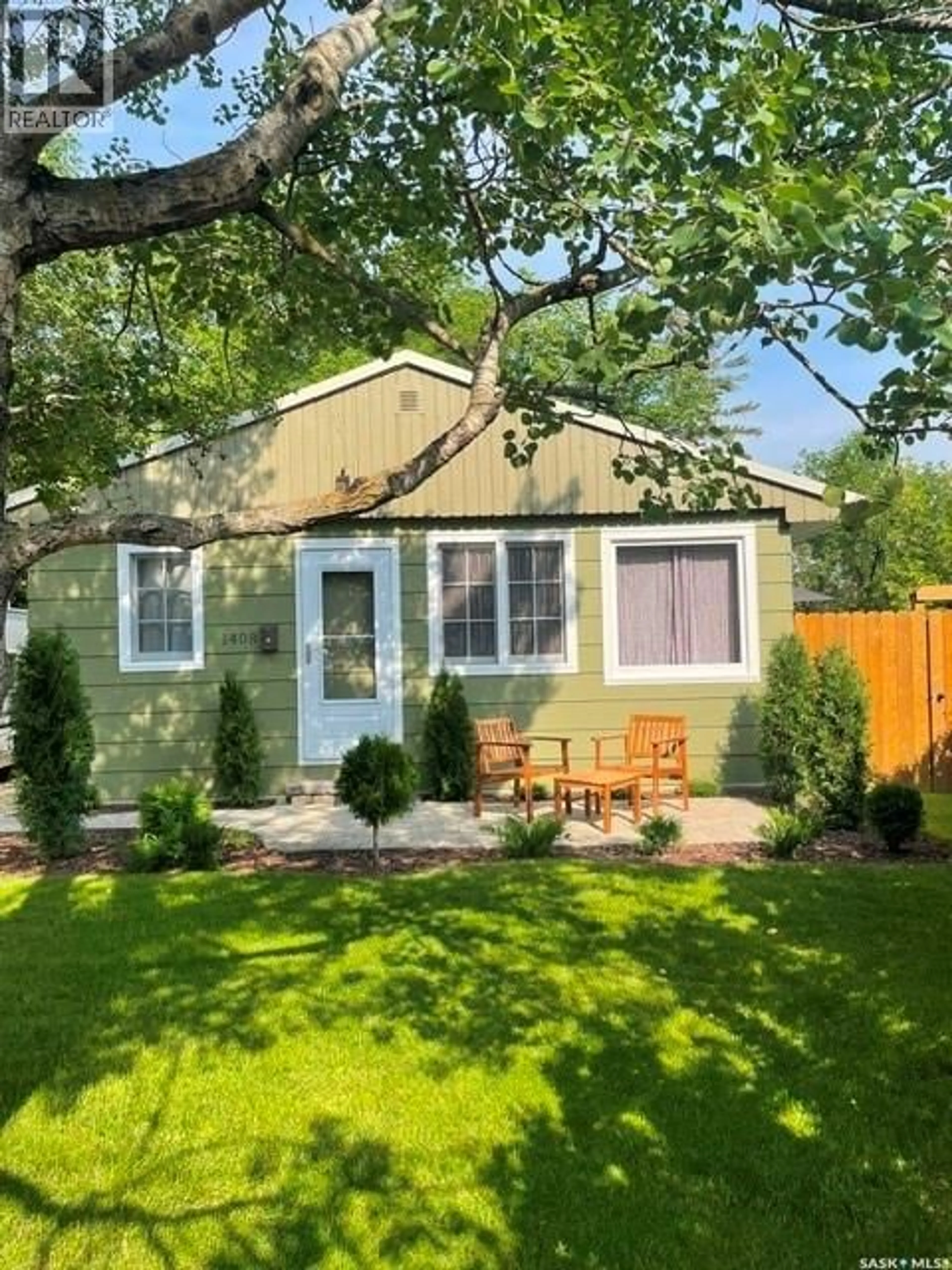 Home with vinyl exterior material, street for 1408 6TH AVENUE, Regina Beach Saskatchewan S0G4C0