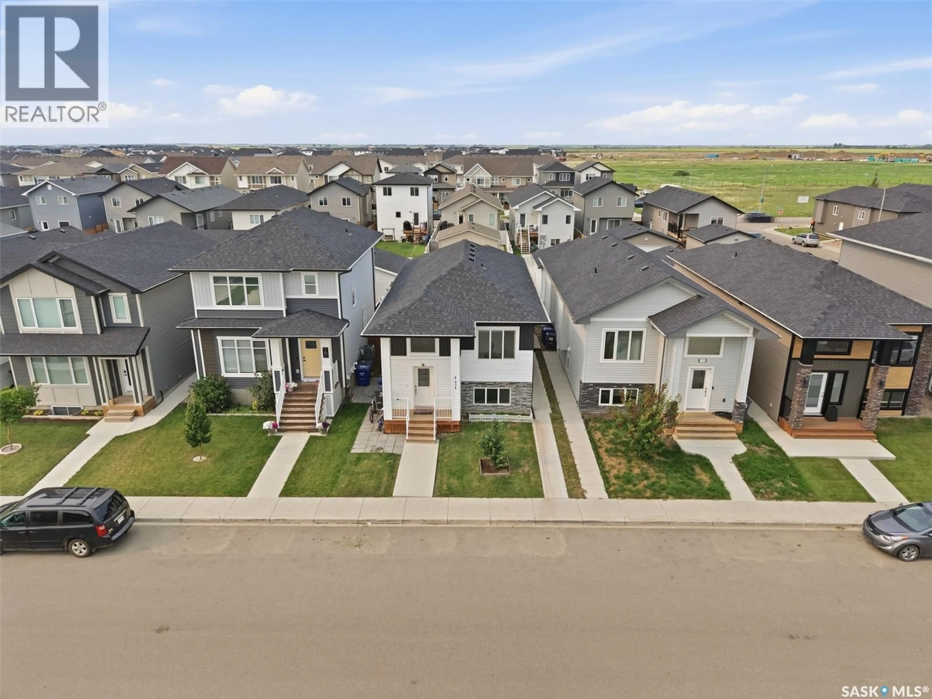 A pic from outside/outdoor area/front of a property/back of a property/a pic from drone, street for 171 THAKUR STREET, Saskatoon Saskatchewan S7W1C4