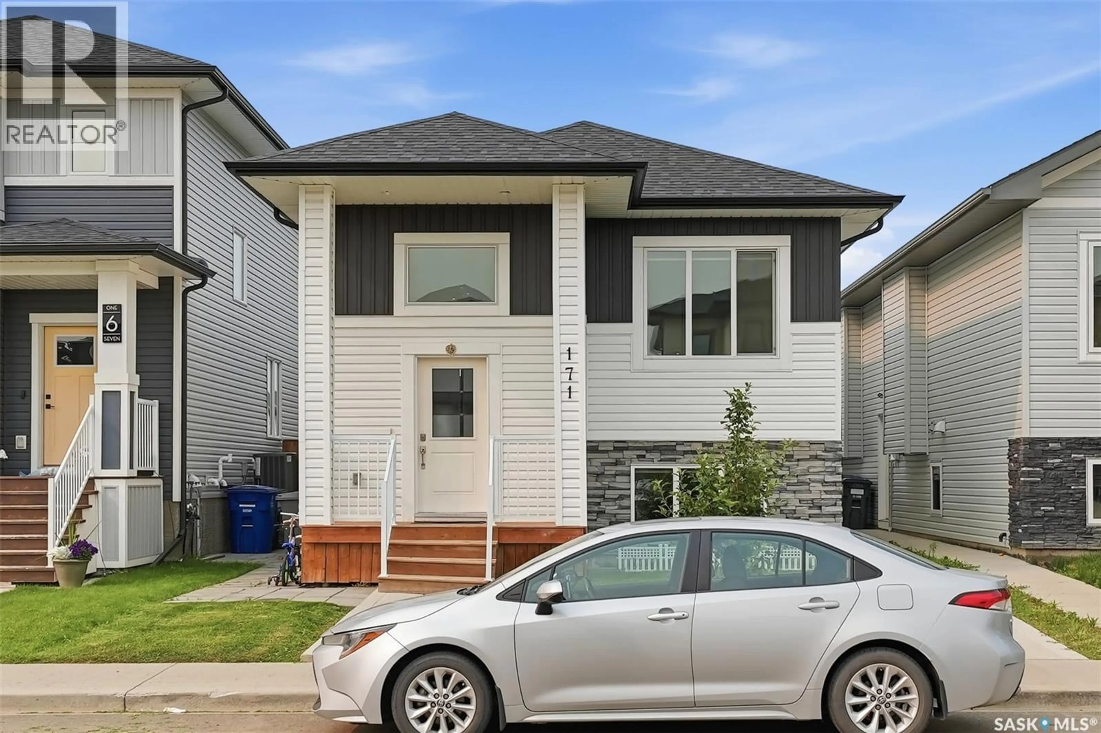 Home with vinyl exterior material, street for 171 THAKUR STREET, Saskatoon Saskatchewan S7W1C4