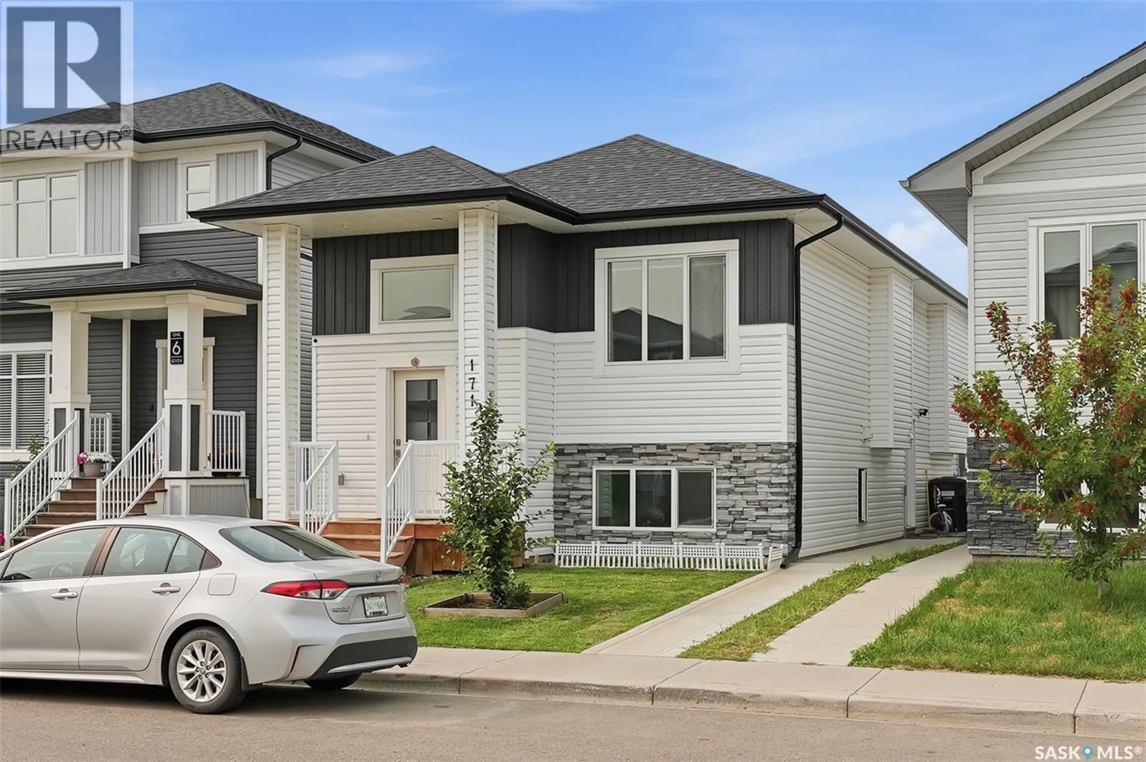 Home with vinyl exterior material, street for 171 THAKUR STREET, Saskatoon Saskatchewan S7W1C4