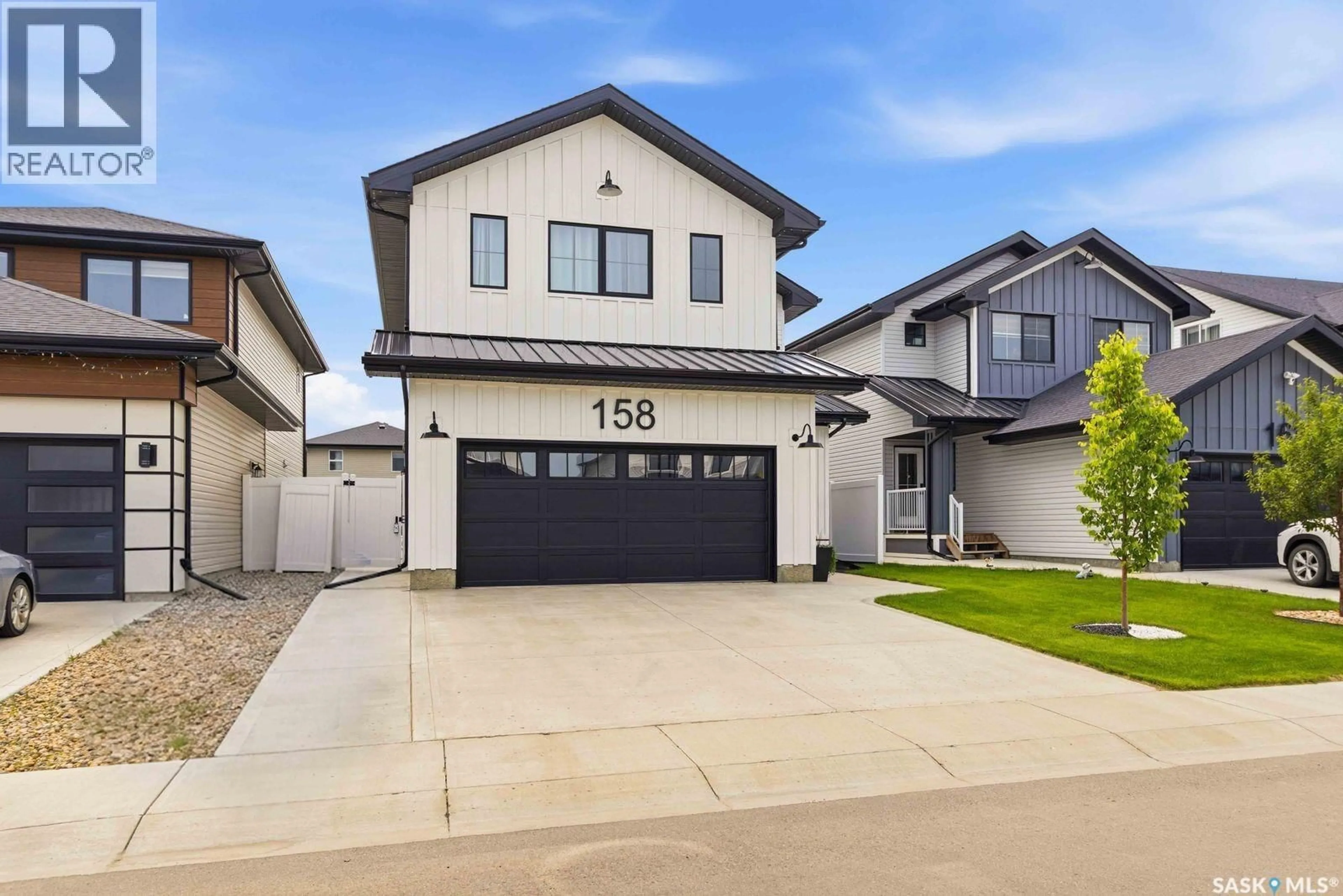 Home with vinyl exterior material, street for 158 CHELSOM BEND, Saskatoon Saskatchewan S7V0Z9