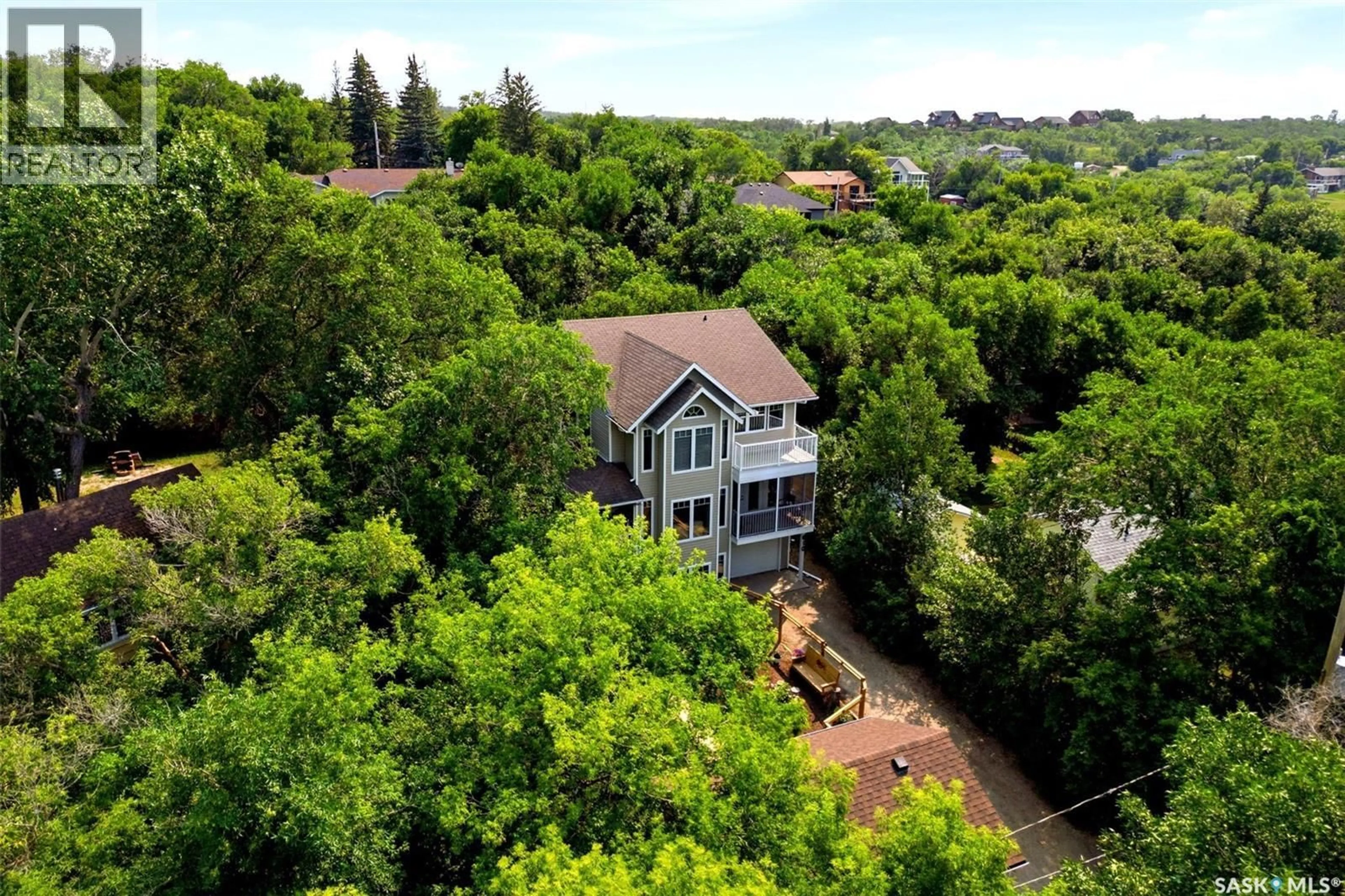 A pic from outside/outdoor area/front of a property/back of a property/a pic from drone, water/lake/river/ocean view for 610 NICOLL LANE, Regina Beach Saskatchewan S0G4C0