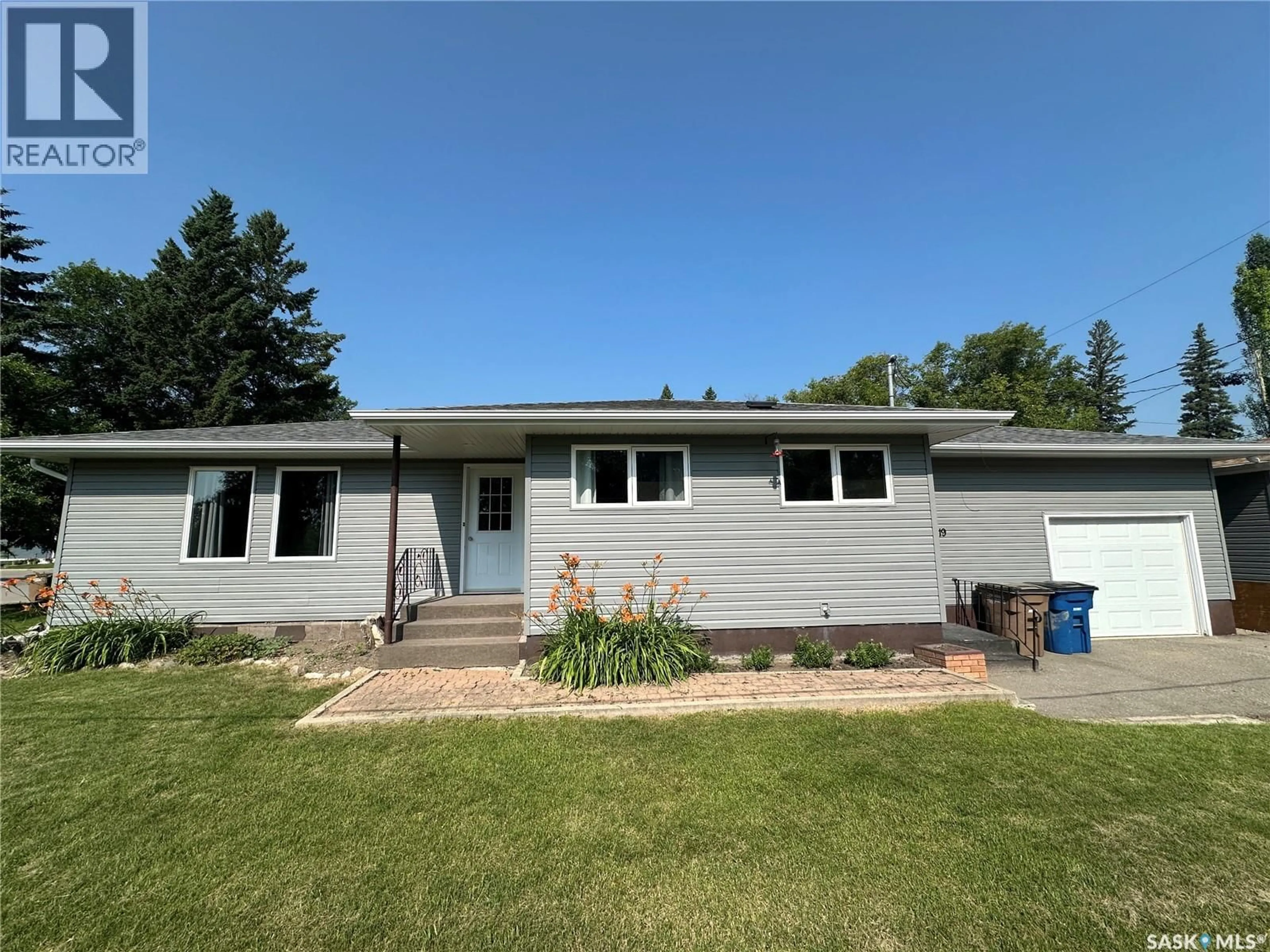 Home with vinyl exterior material, street for 1119 98TH AVENUE, Tisdale Saskatchewan S0E1T0