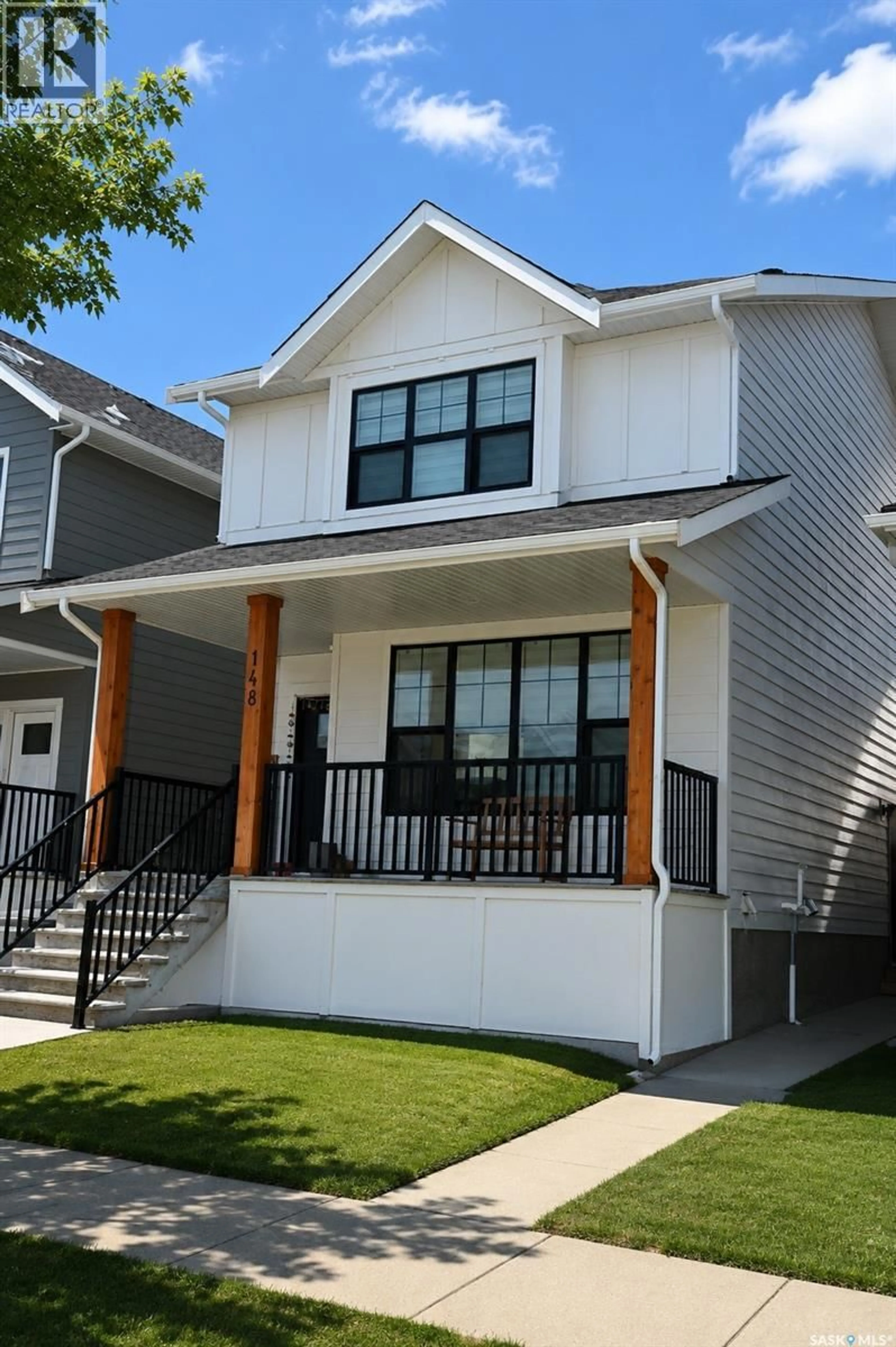 Home with vinyl exterior material, street for 148 ROSEWOOD BOULEVARD, Saskatoon Saskatchewan S7V0Y9