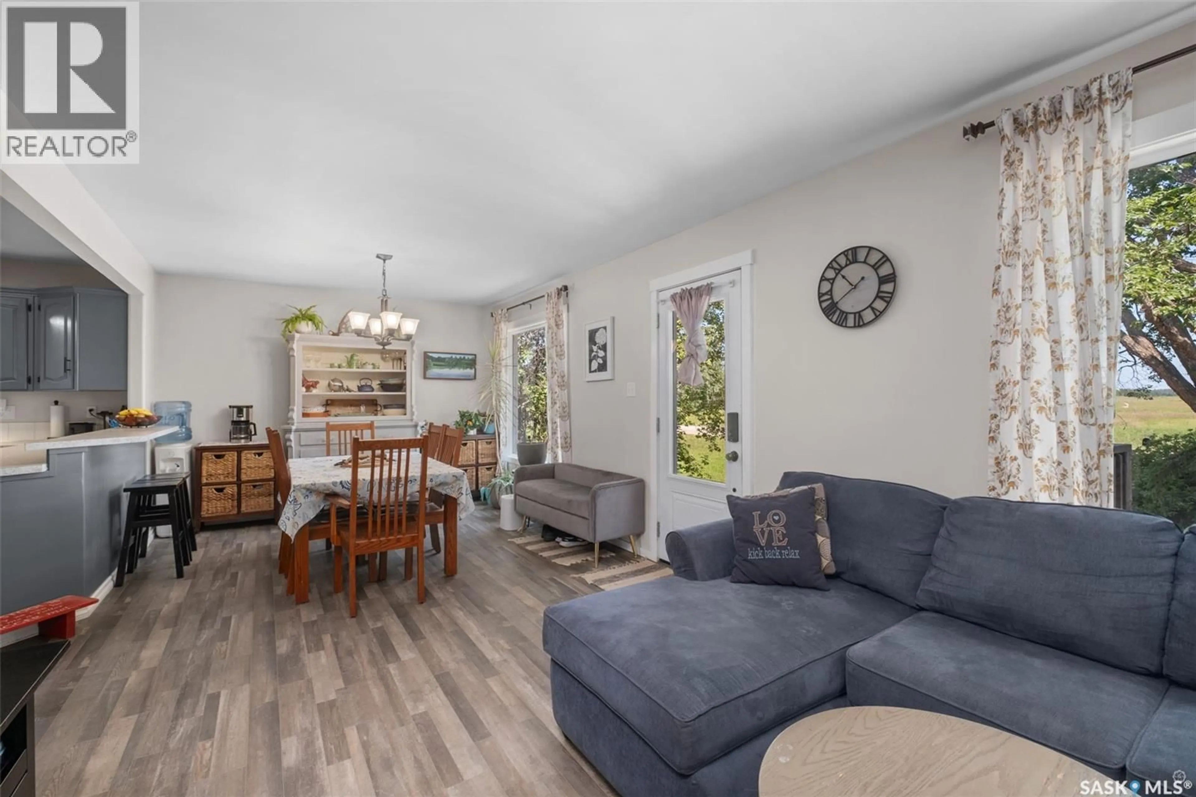 Living room with furniture, wood/laminate floor for 68 RED DEER HILL ROAD, Prince Albert Rm No. 461 Saskatchewan S6V5P9