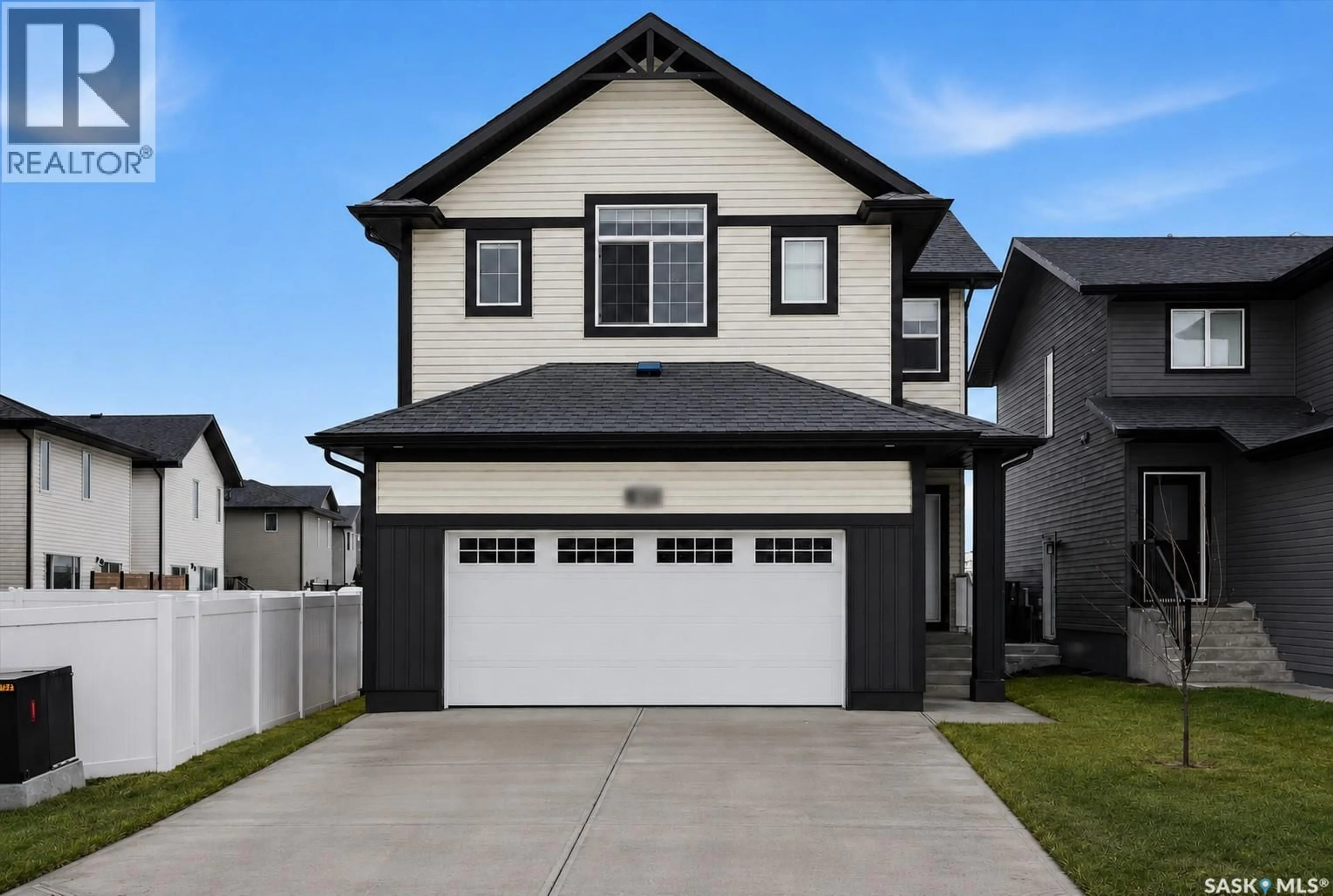 Home with vinyl exterior material, street for 595 COCKCROFT COURT, Saskatoon Saskatchewan S7V1Y8