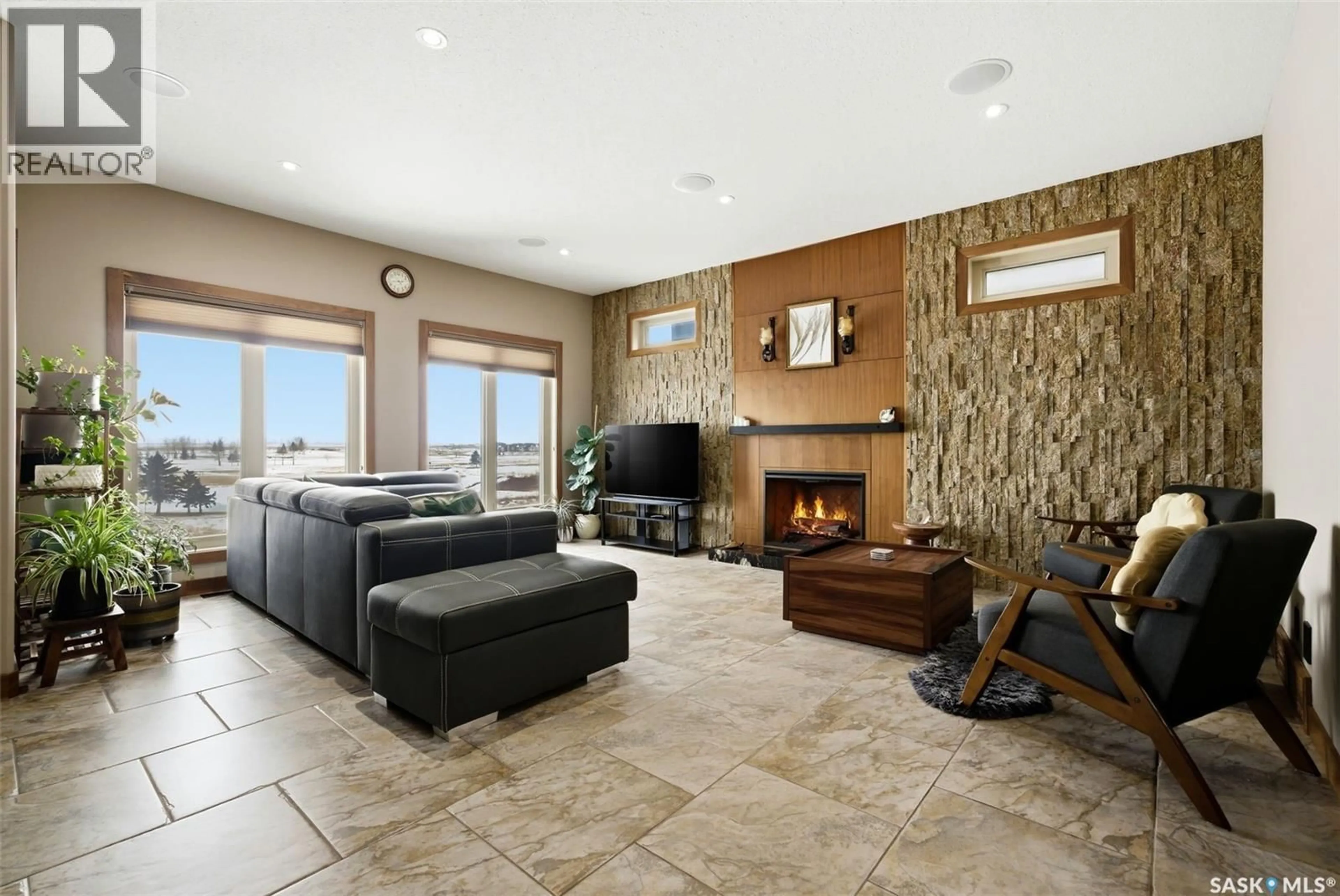 Living room with furniture, ceramic/tile floor for 7502 LILAC PLACE, Regina Saskatchewan S4Y0B3