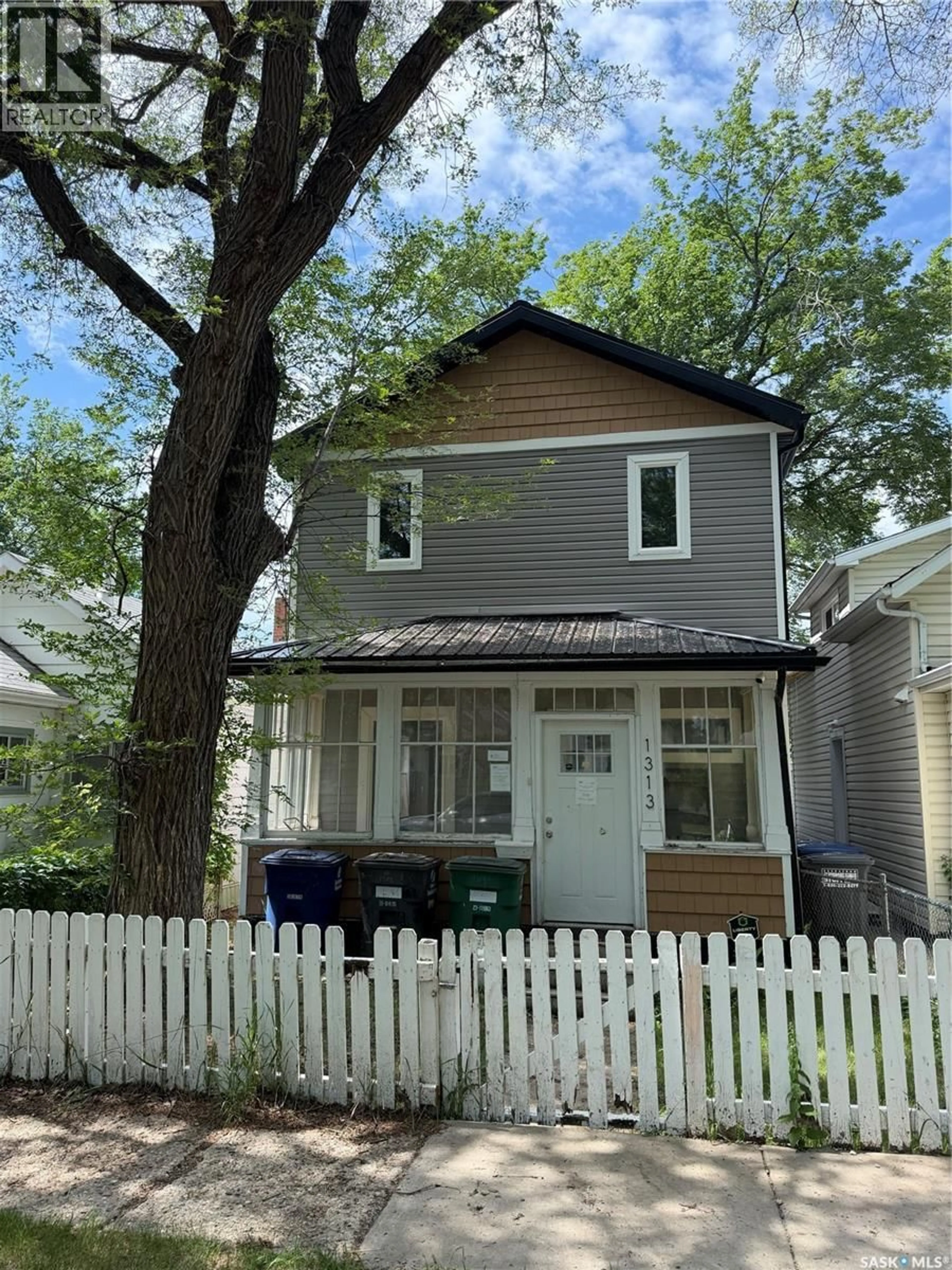 Home with vinyl exterior material, street for 1313 G AVENUE, Saskatoon Saskatchewan S7L2A6