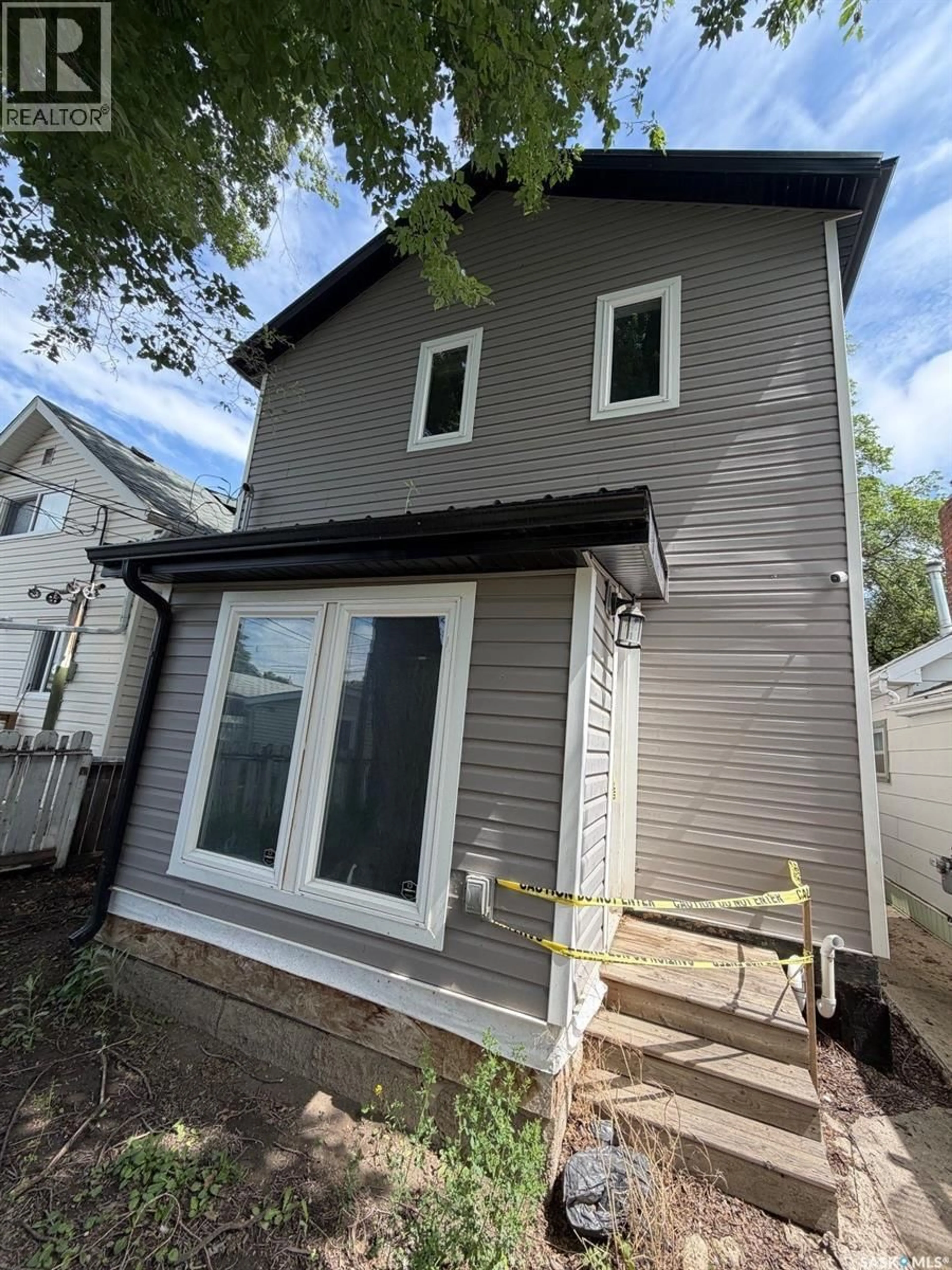 Home with vinyl exterior material, street for 1313 G AVENUE, Saskatoon Saskatchewan S7L2A6