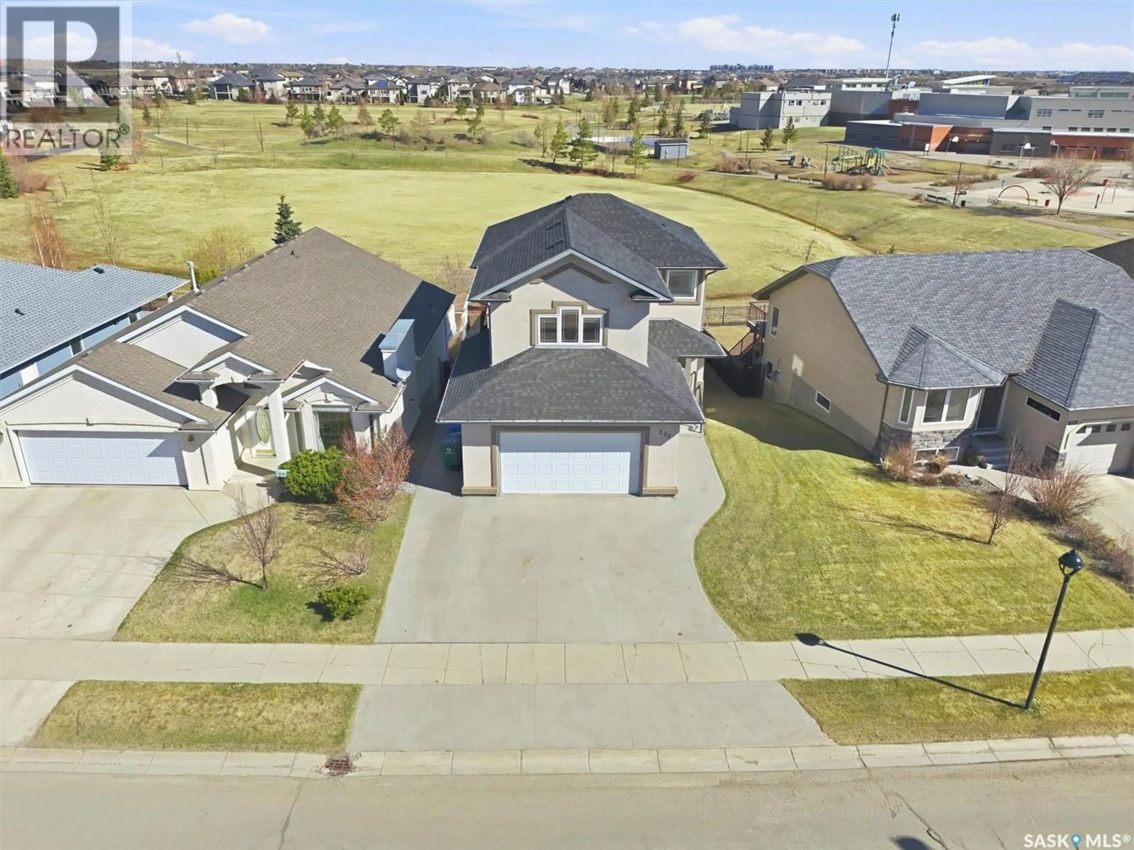 A pic from outside/outdoor area/front of a property/back of a property/a pic from drone, street for 231 WILLOWGROVE BOULEVARD, Saskatoon Saskatchewan S7W1A1