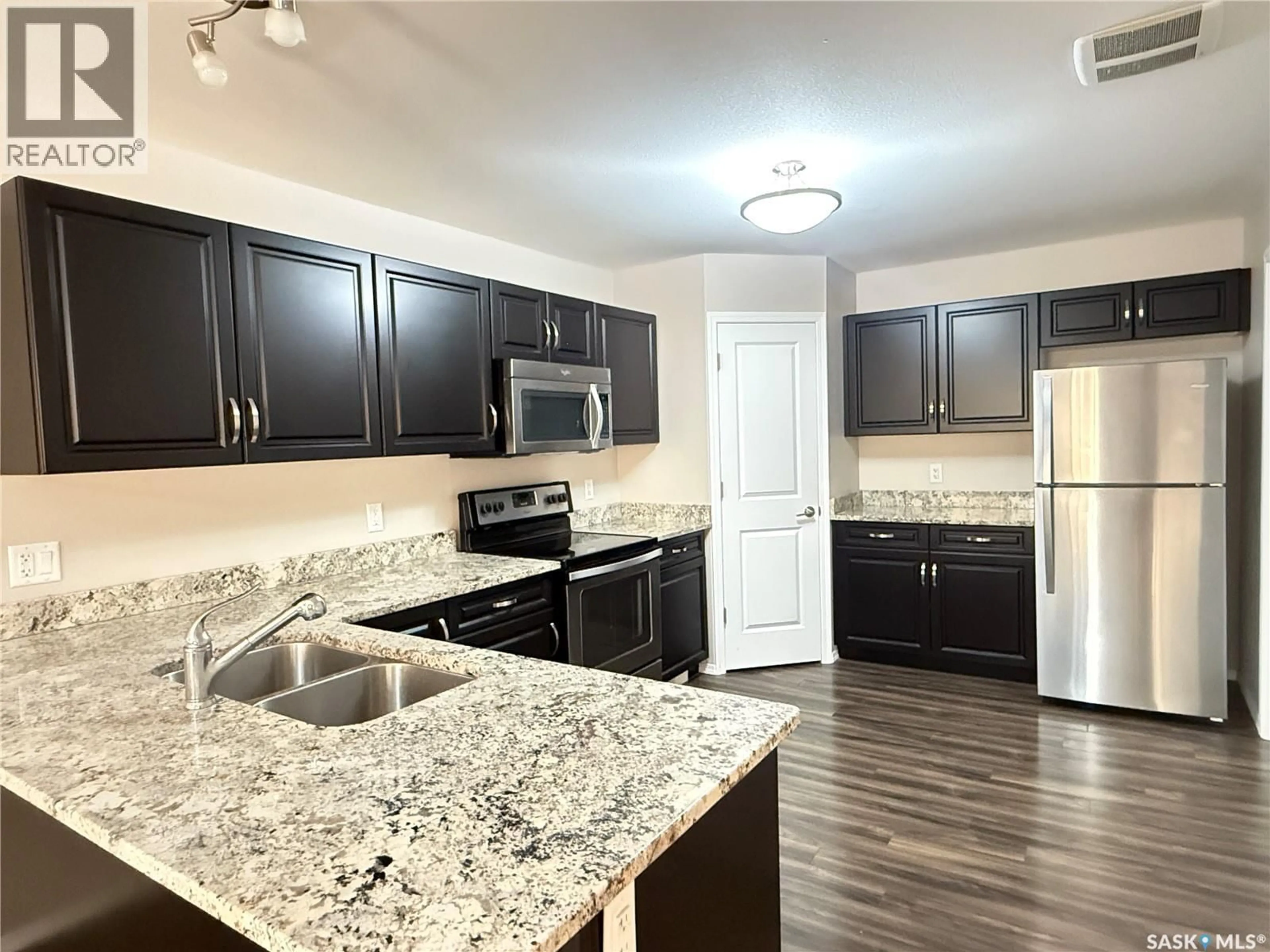 Open concept kitchen, unknown for 100 - 331 CHAPARRAL BOULEVARD, Martensville Saskatchewan S0K0A2