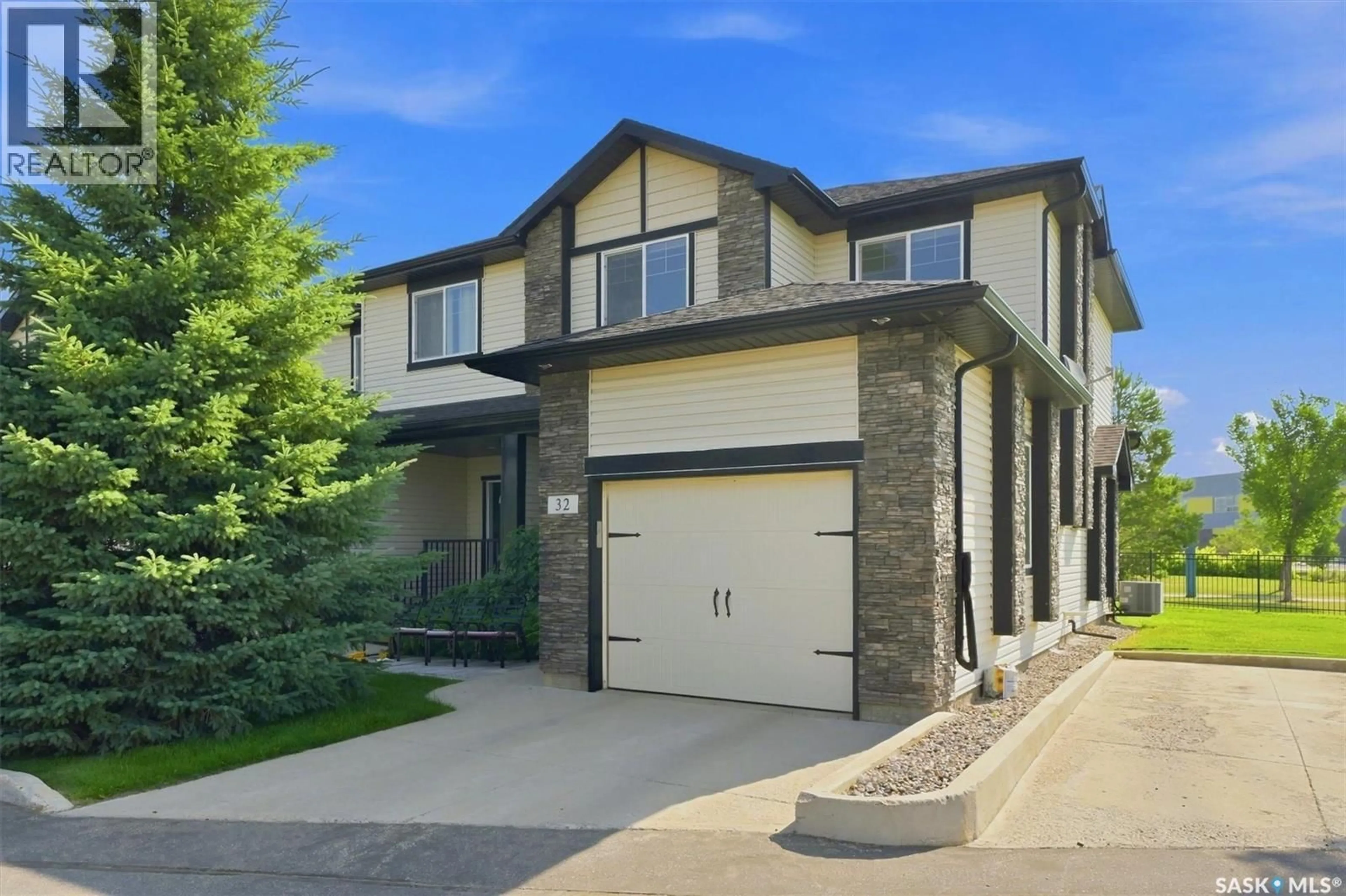 Home with brick exterior material, street for 32 215 HAMPTON GREEN, Saskatoon Saskatchewan S7R0G7