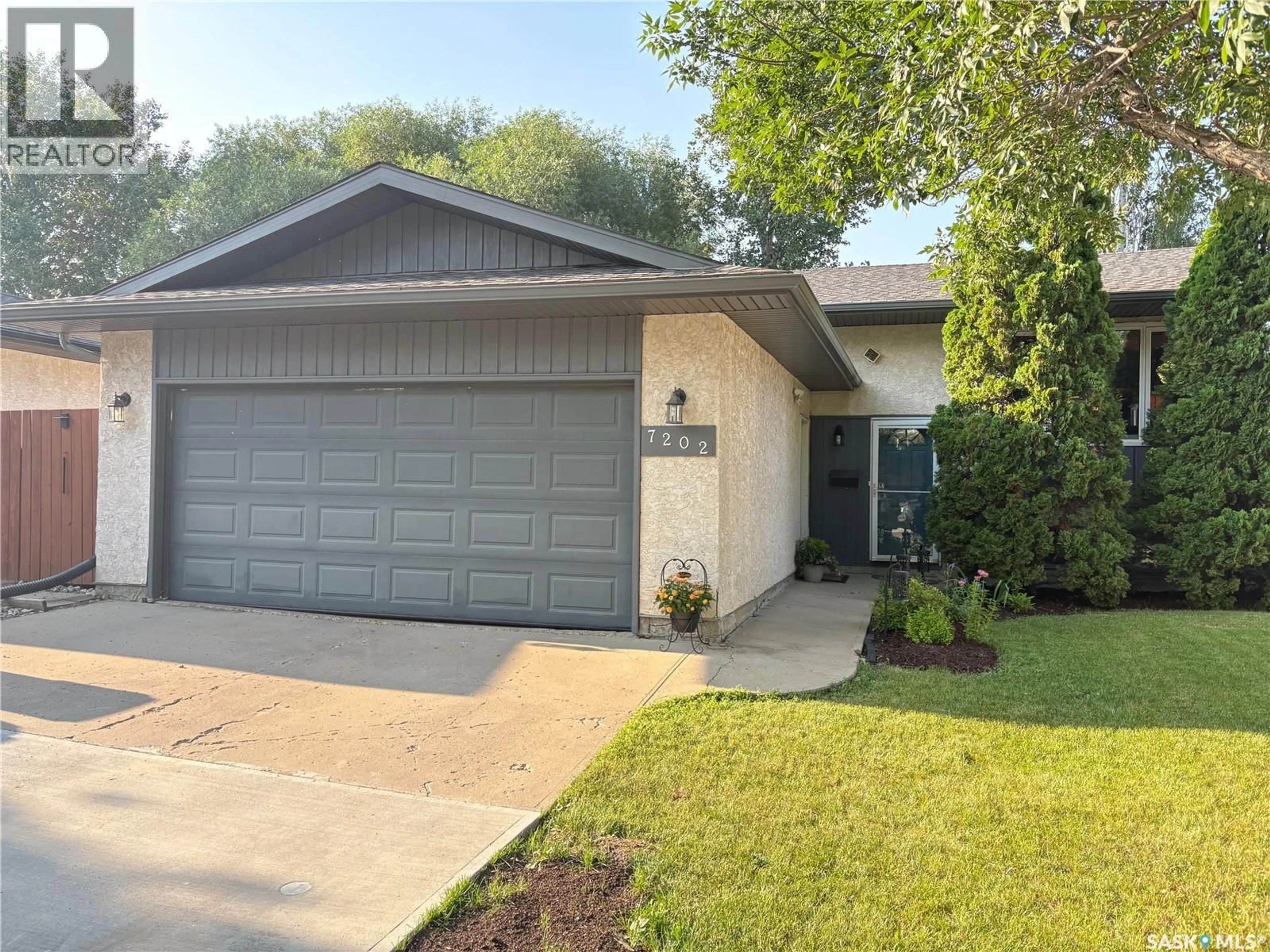 Home with vinyl exterior material, street for 7202 LAWRENCE DRIVE, Regina Saskatchewan S4X3X7