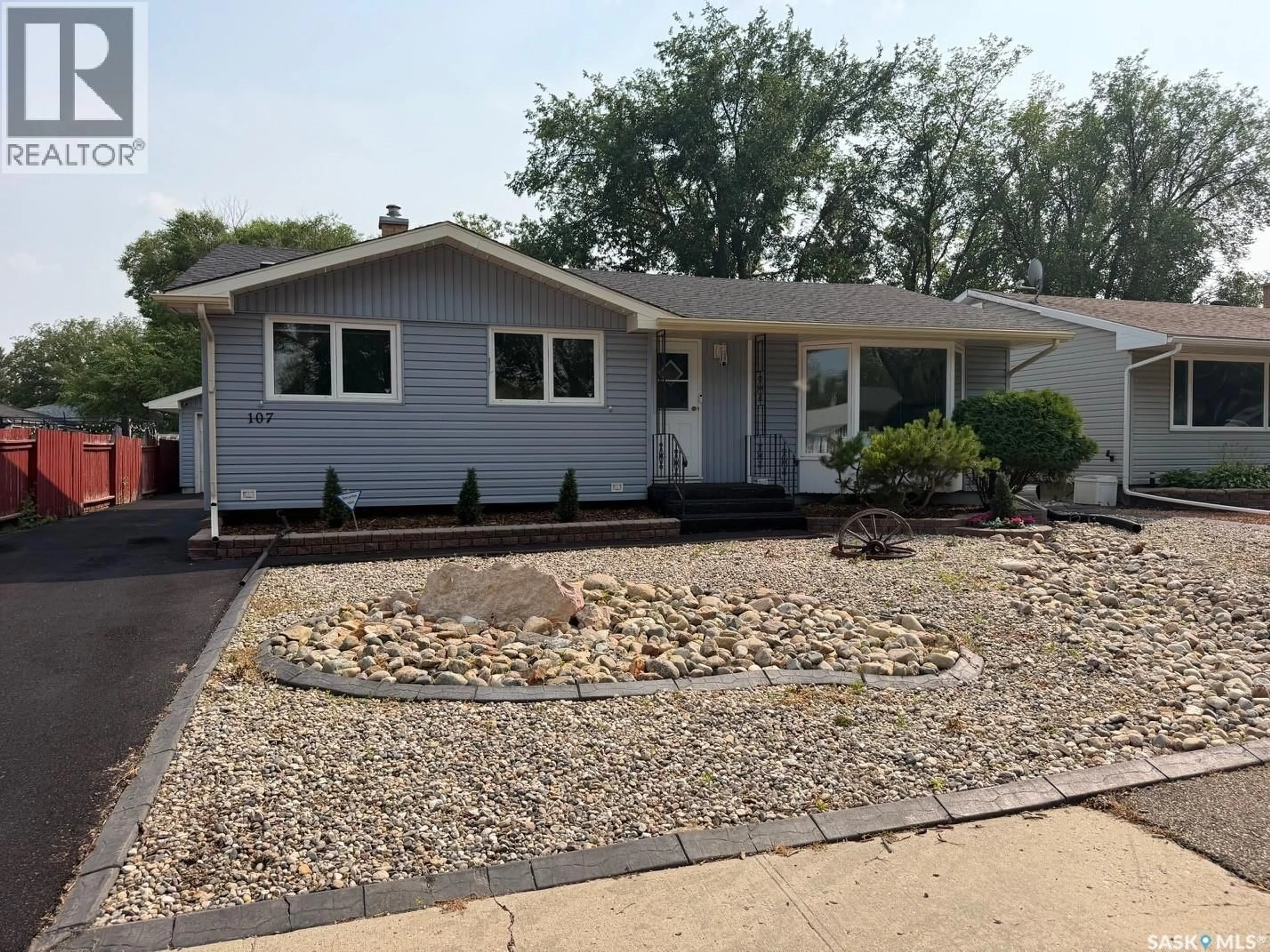 Home with vinyl exterior material, street for 107 MERLIN CRESCENT, Regina Saskatchewan S4R3E6