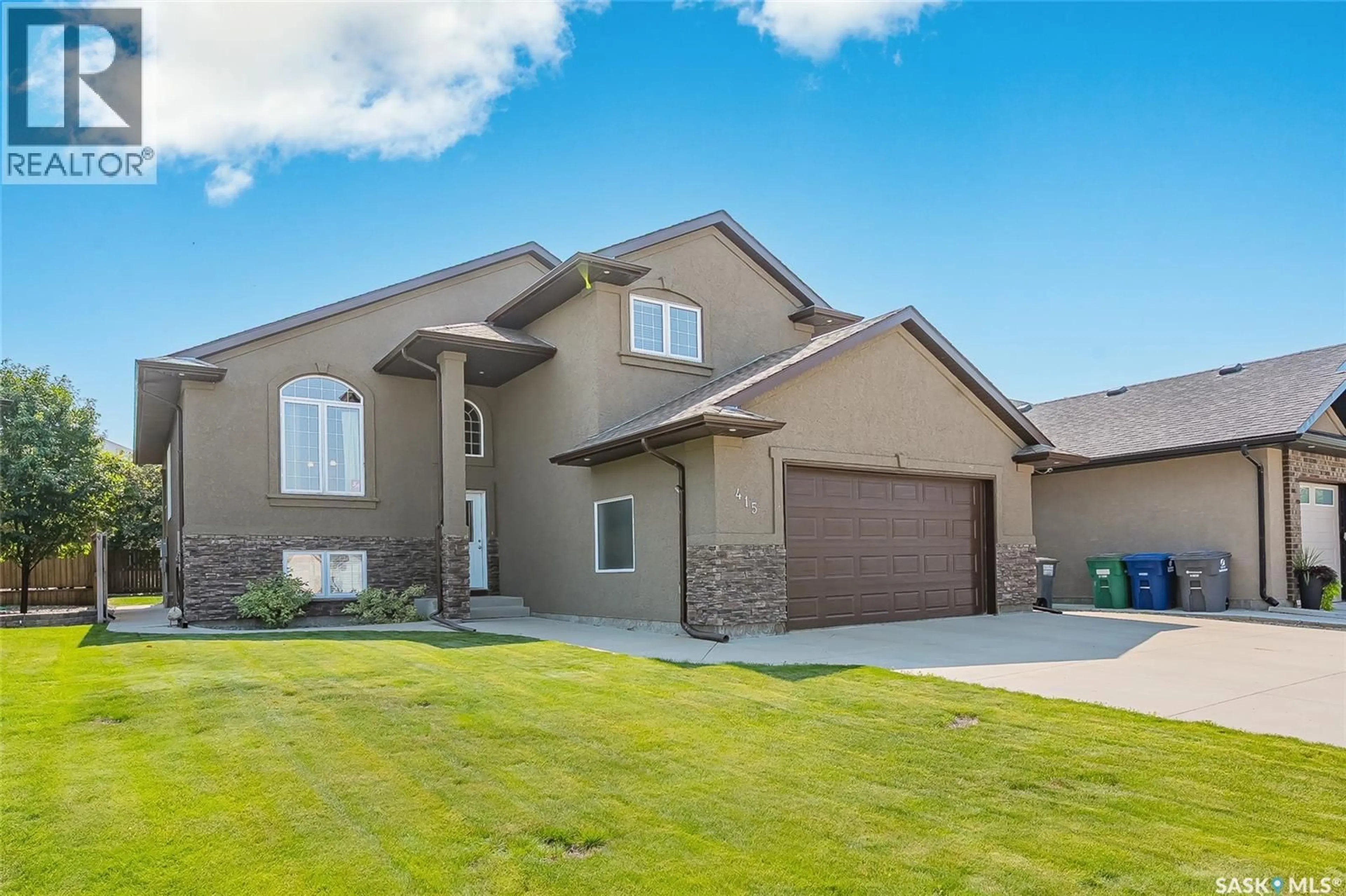 Home with vinyl exterior material, street for 415 PATON PLACE, Saskatoon Saskatchewan S7W0B8