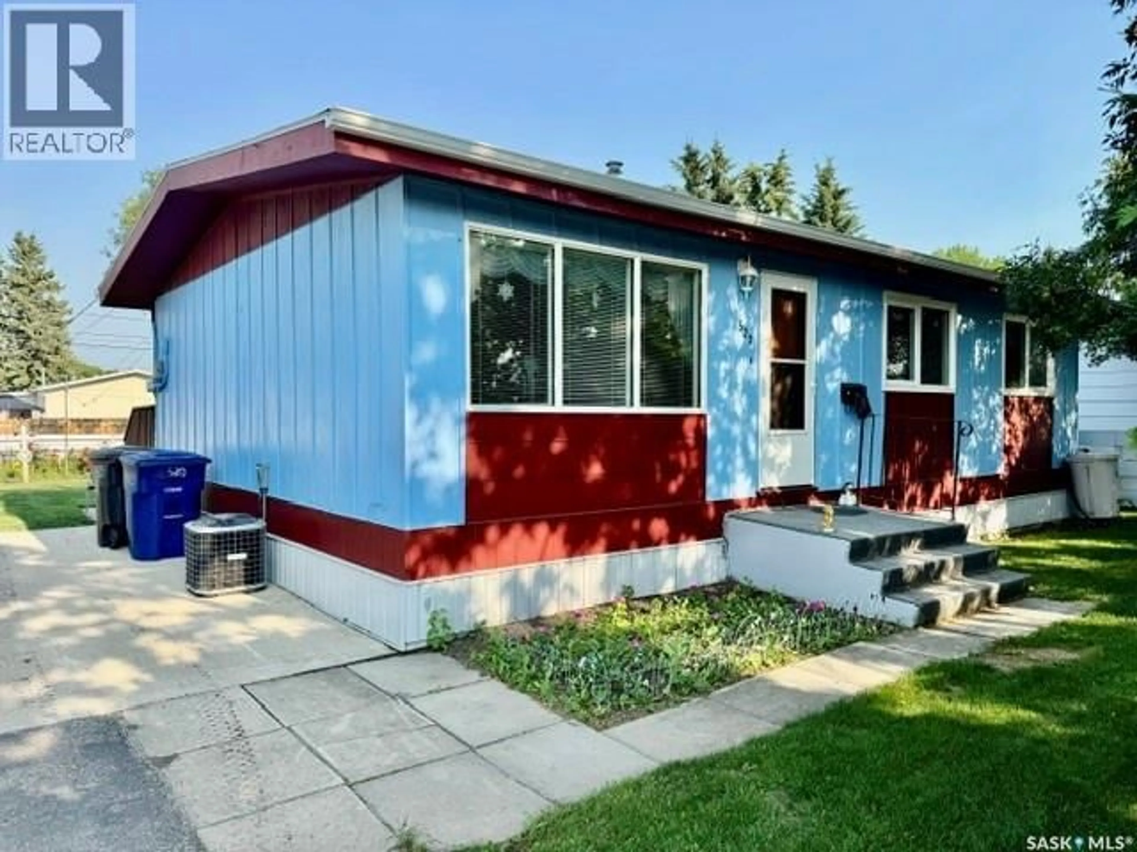 Home with vinyl exterior material, street for 520 3RD STREET, Humboldt Saskatchewan S0K2A0