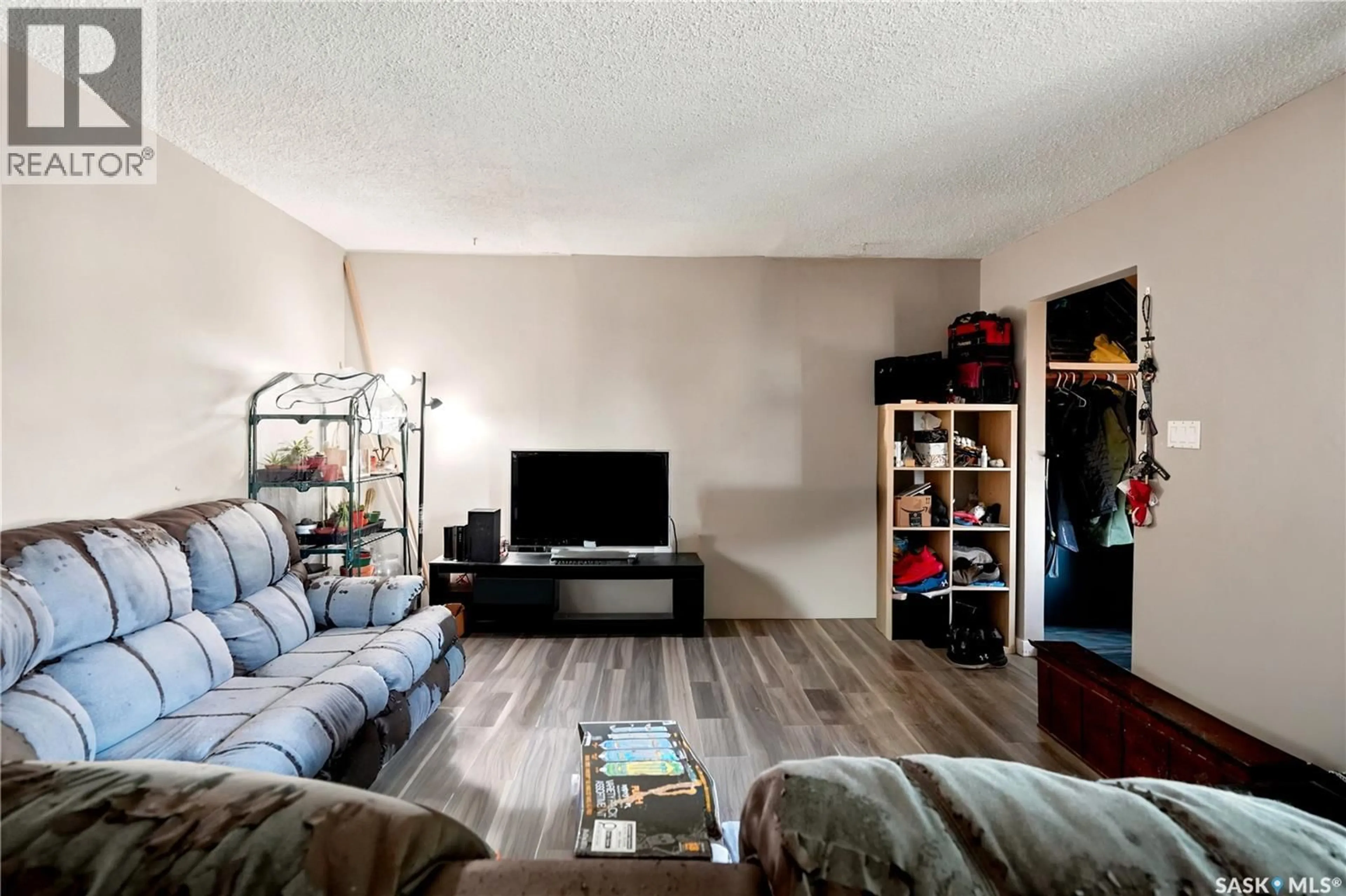 Living room with furniture, wood/laminate floor for 2232 MCARA STREET, Regina Saskatchewan S4N2W1